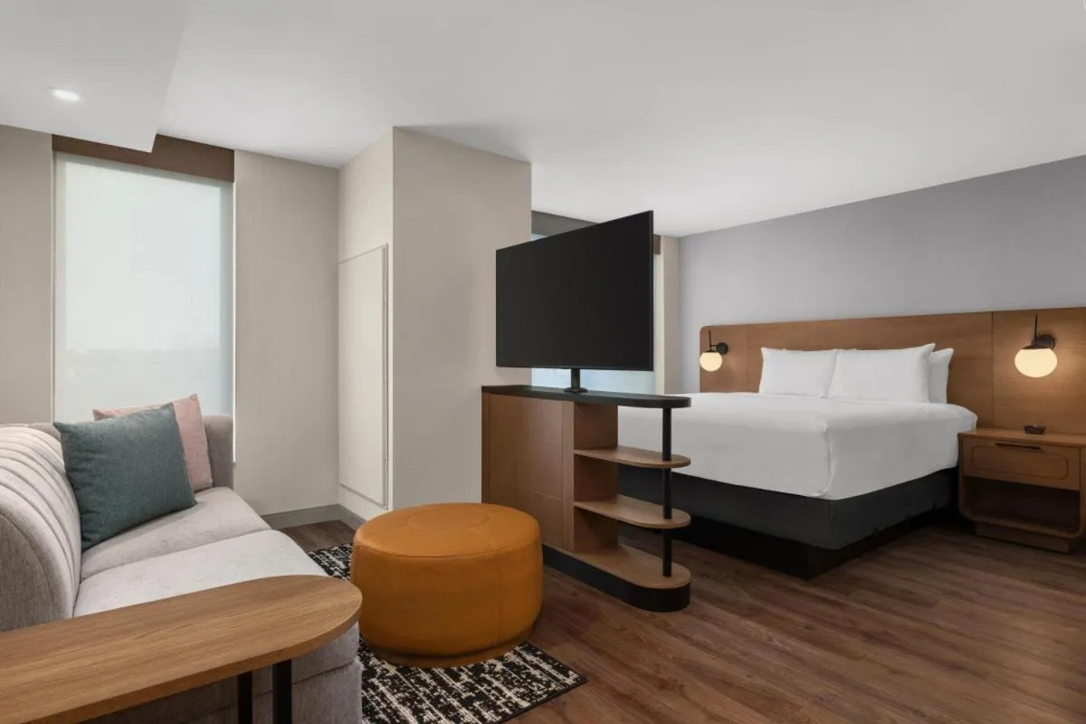 Seating area, Bed in Hyatt House Mississauga / Airport Corp Center