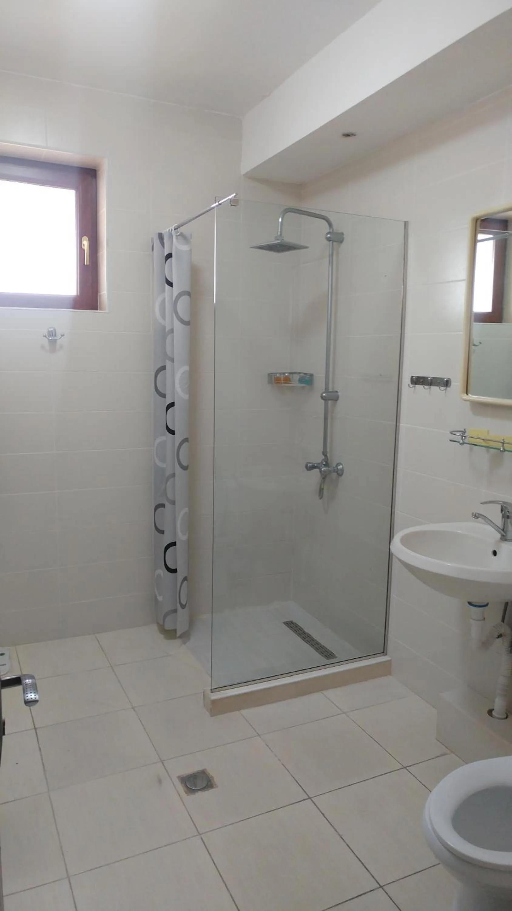 Shower in Cross Apartments and Tours