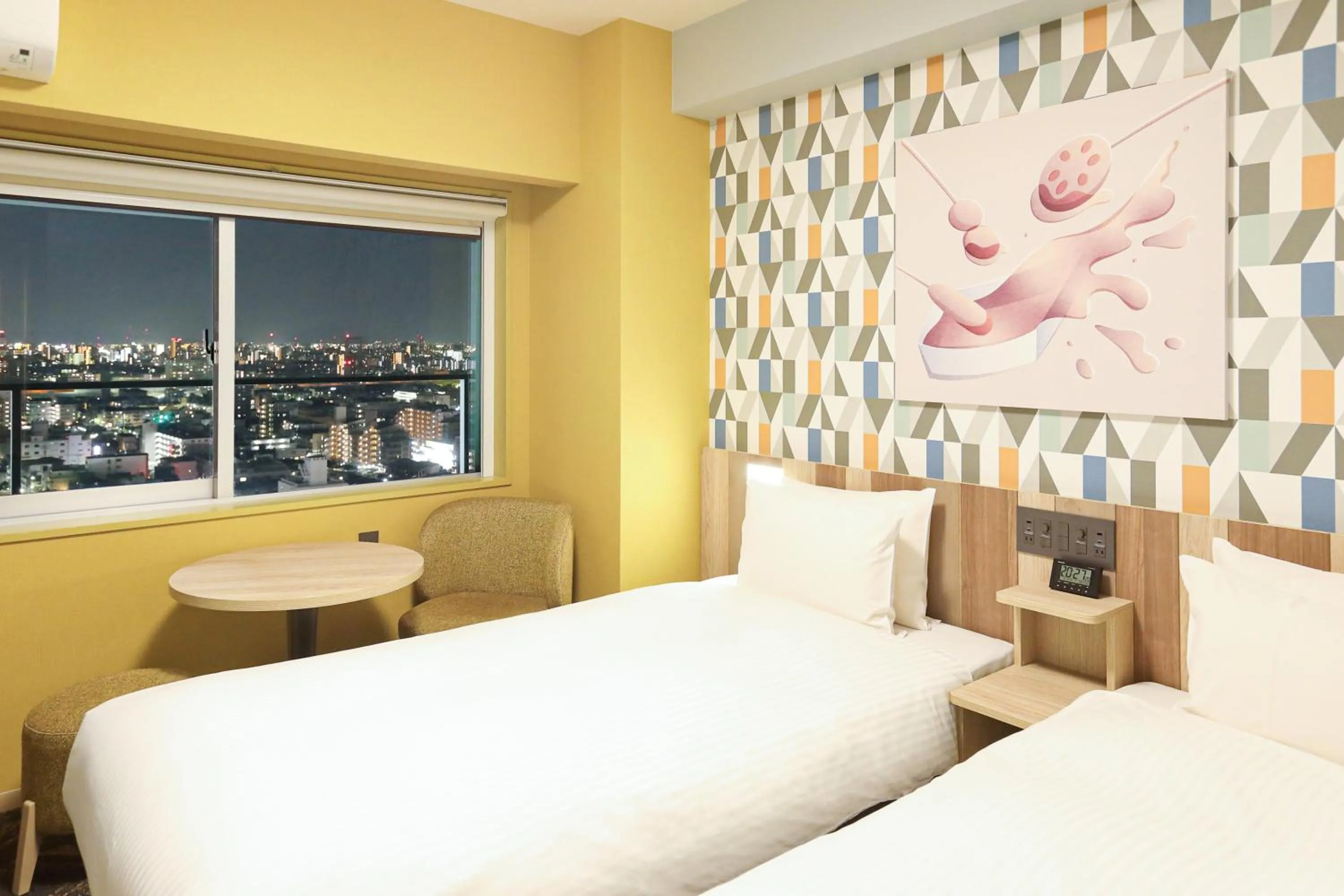 Bed in Hiyori Hotel Osaka Suminoekoen Station