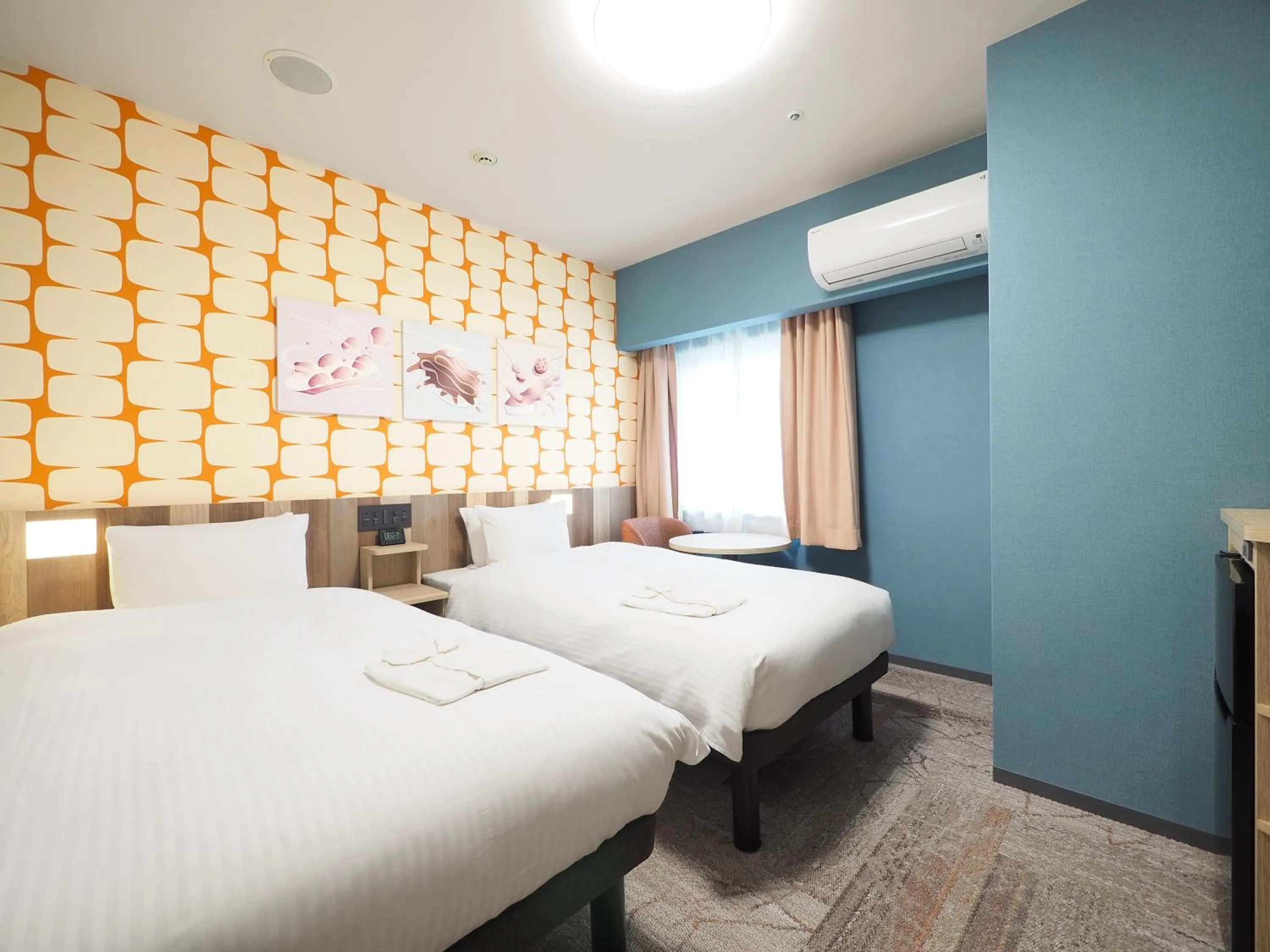 Bed in Hiyori Hotel Osaka Suminoekoen Station