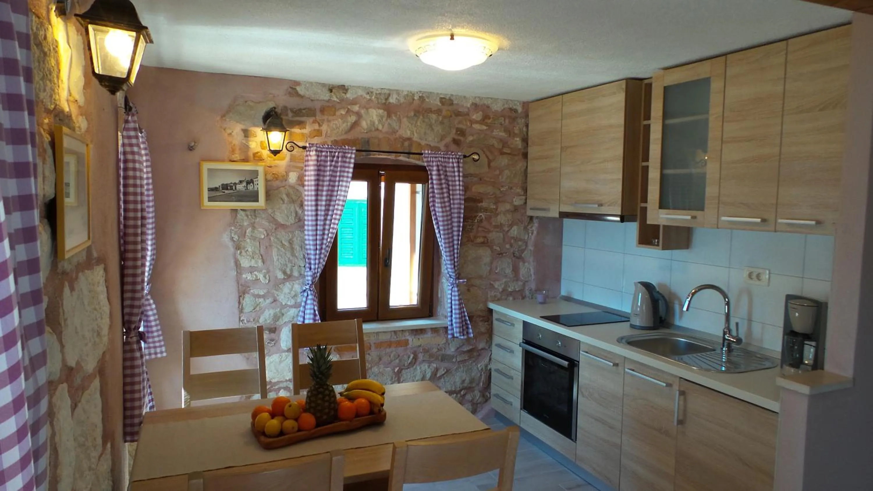 Kitchen or kitchenette in Apartments Dvor