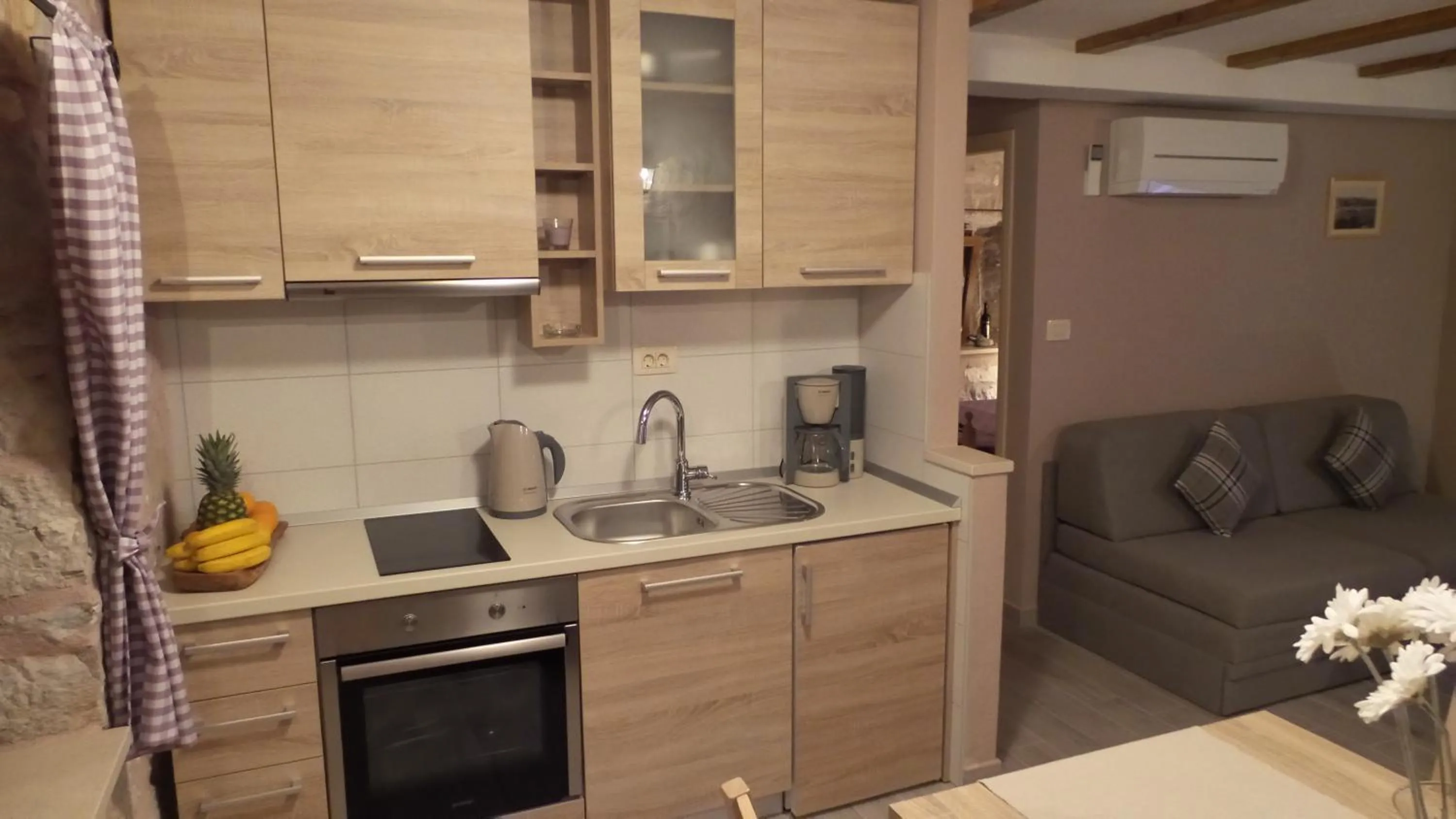 Kitchen or kitchenette in Apartments Dvor