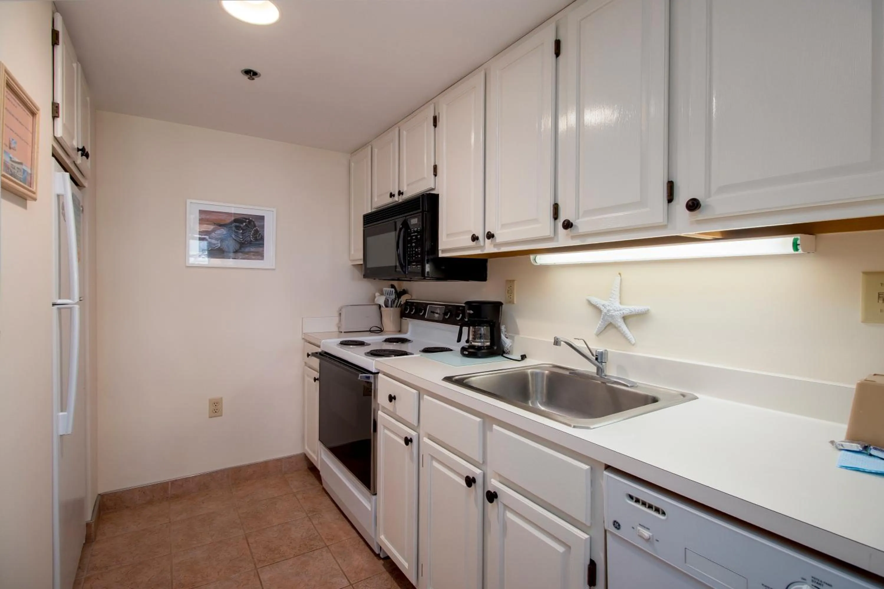 Kitchen or kitchenette in Watson's Regency Suites