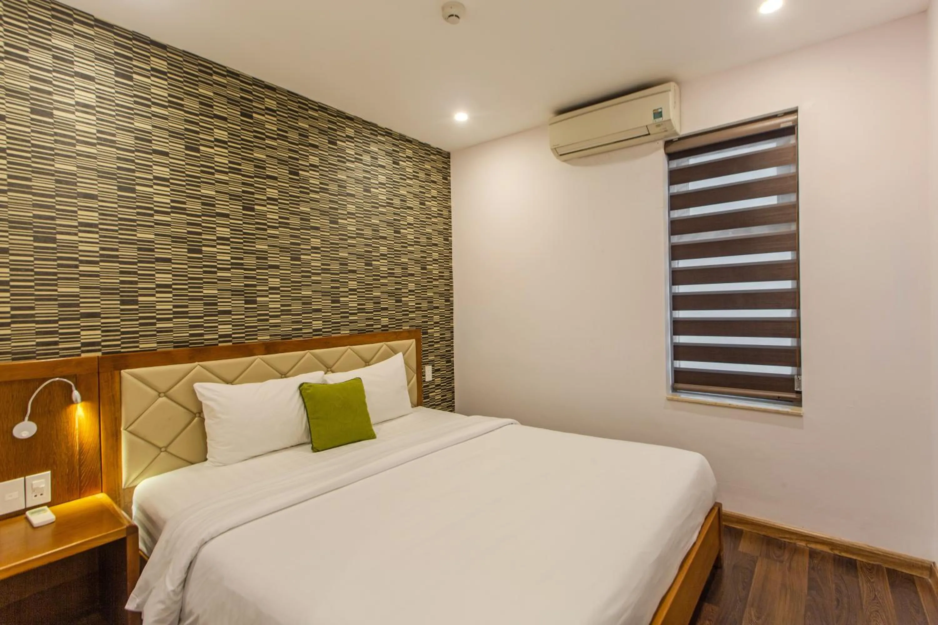 Bed in Richico Apartments And Hotel