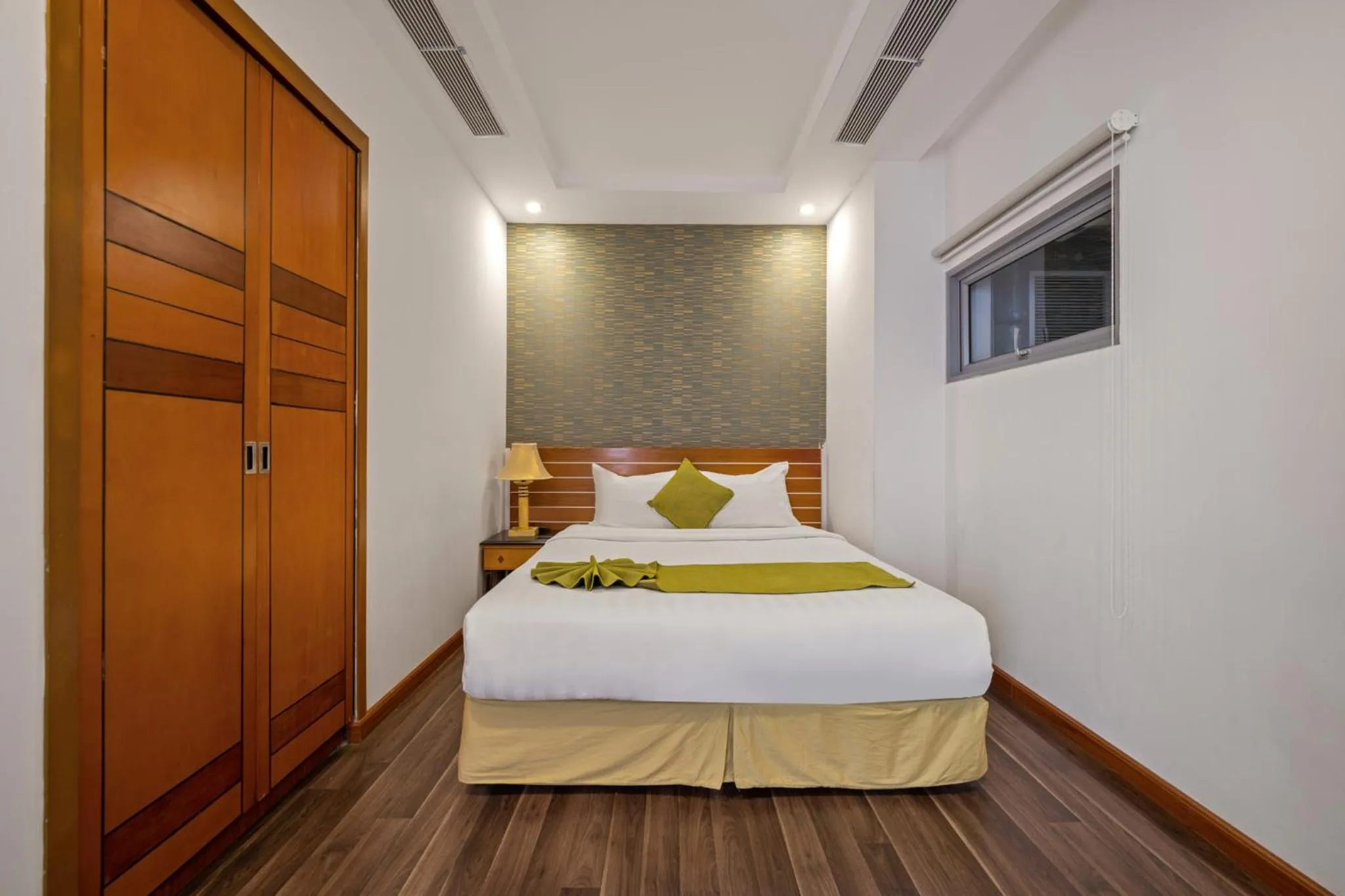 Bed in Richico Apartments And Hotel