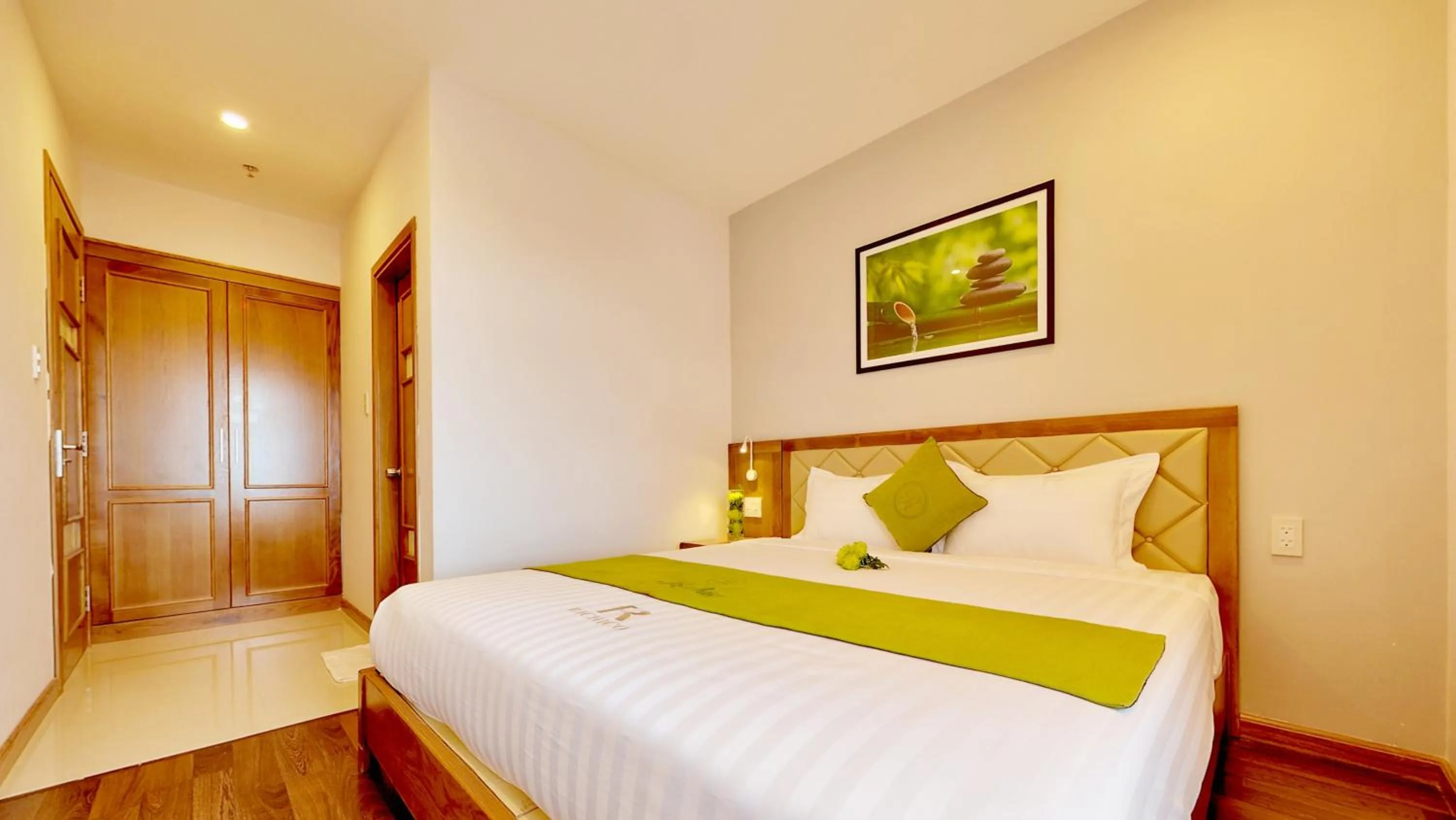 Bed in Richico Apartments And Hotel