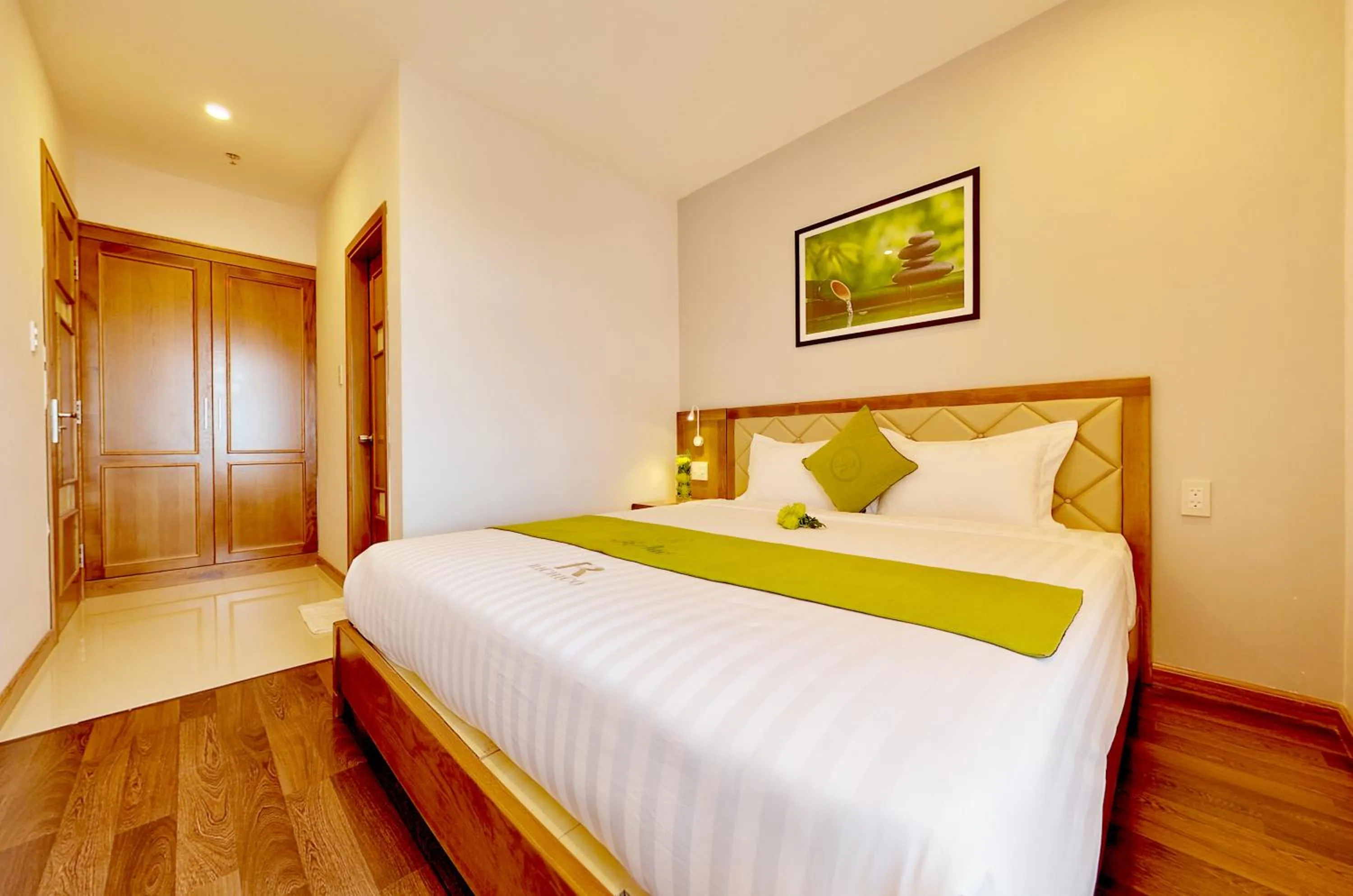 Bed in Richico Apartments And Hotel