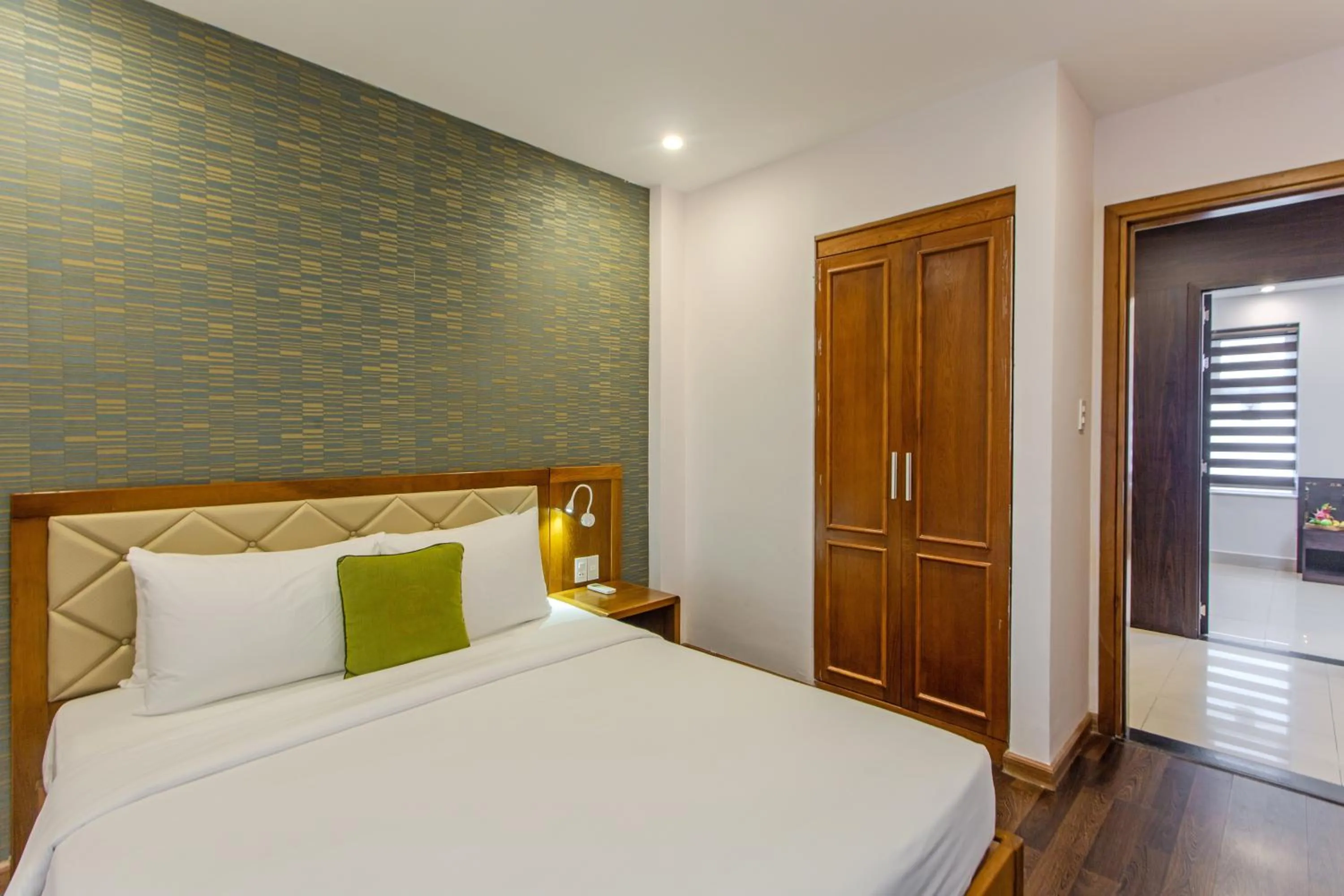 Bed in Richico Apartments And Hotel