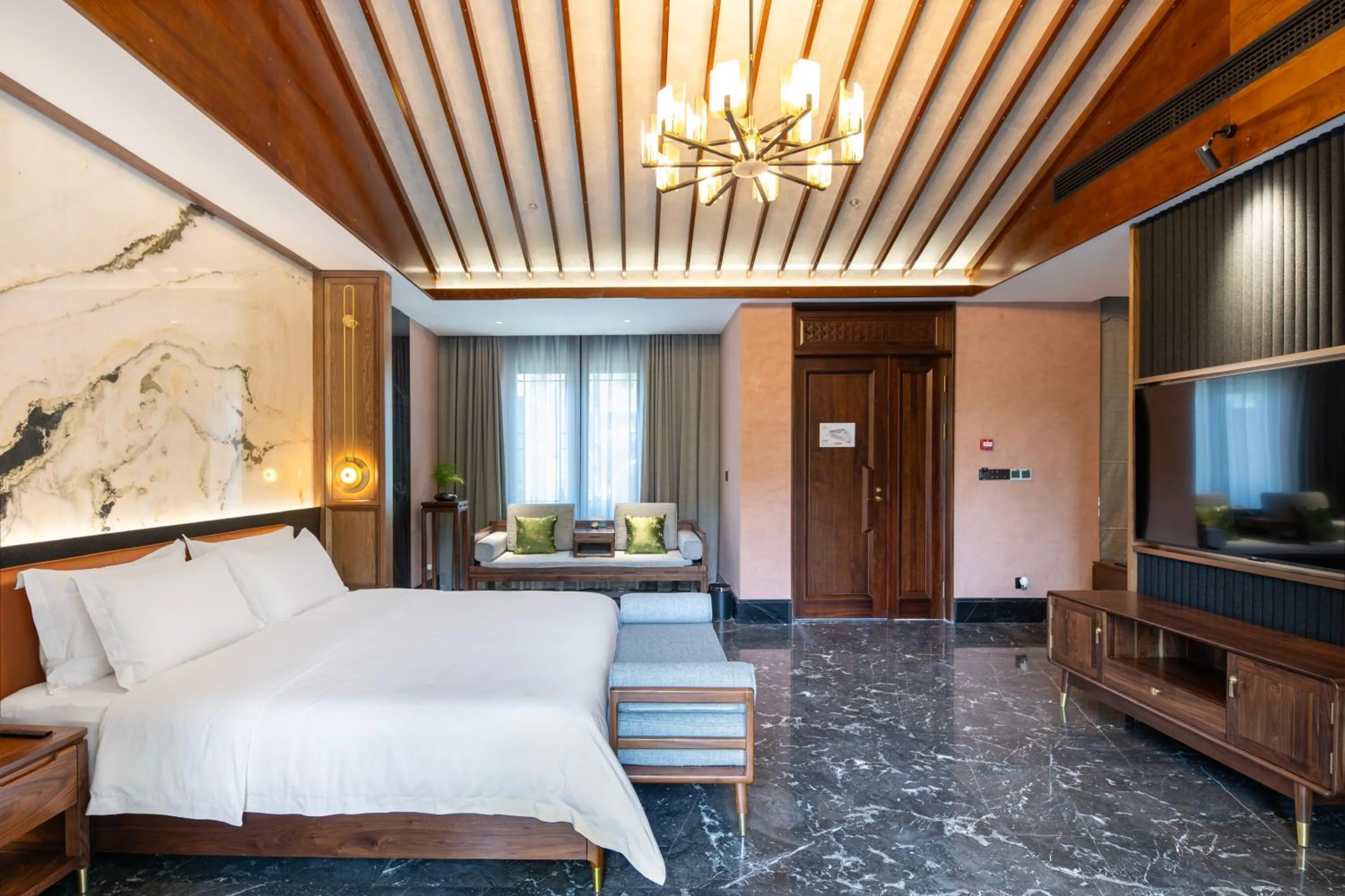 Communal lounge/ TV room, Bed in Moonrise Hotels Resorts