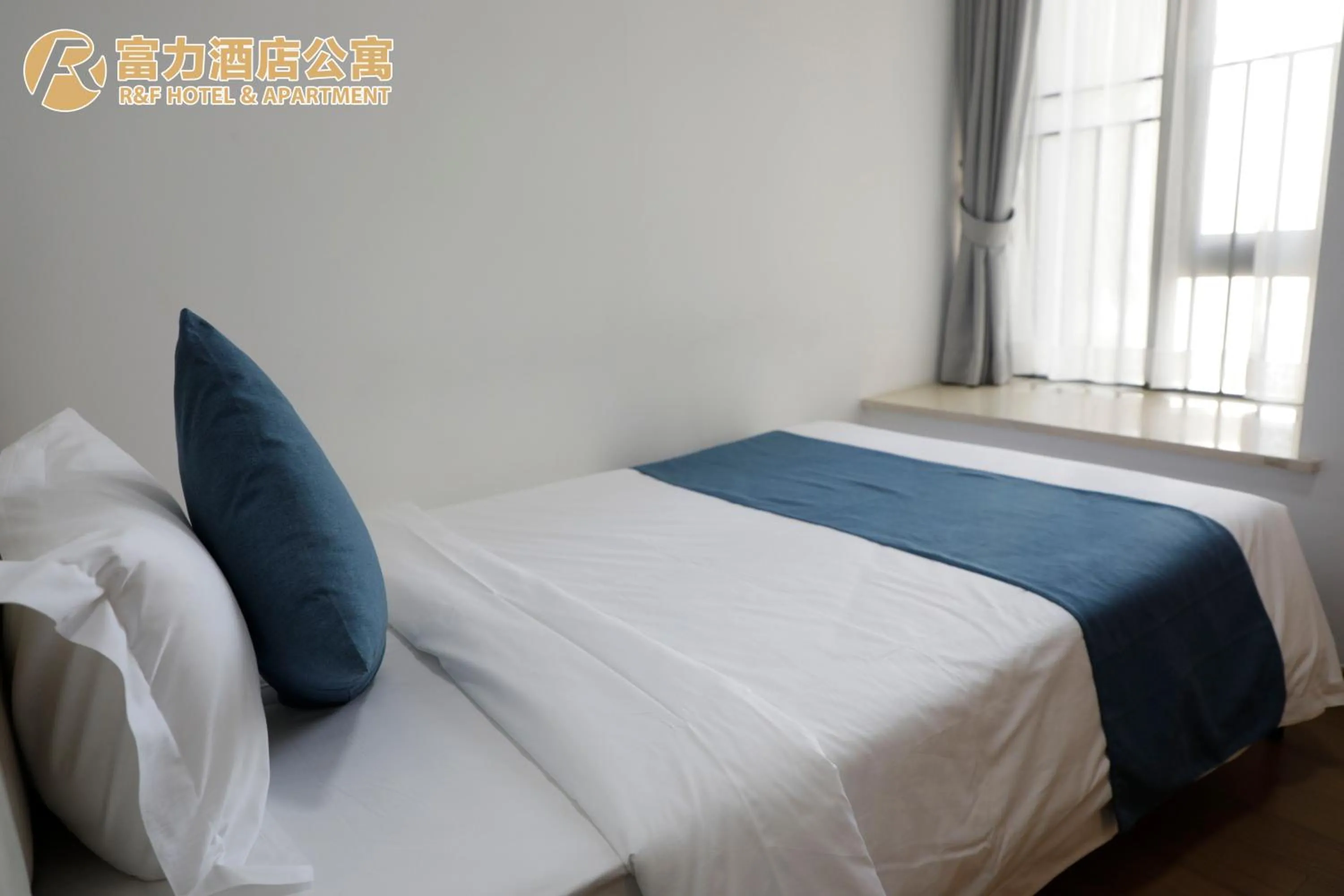 Bed in R&F Hotel and Apartment