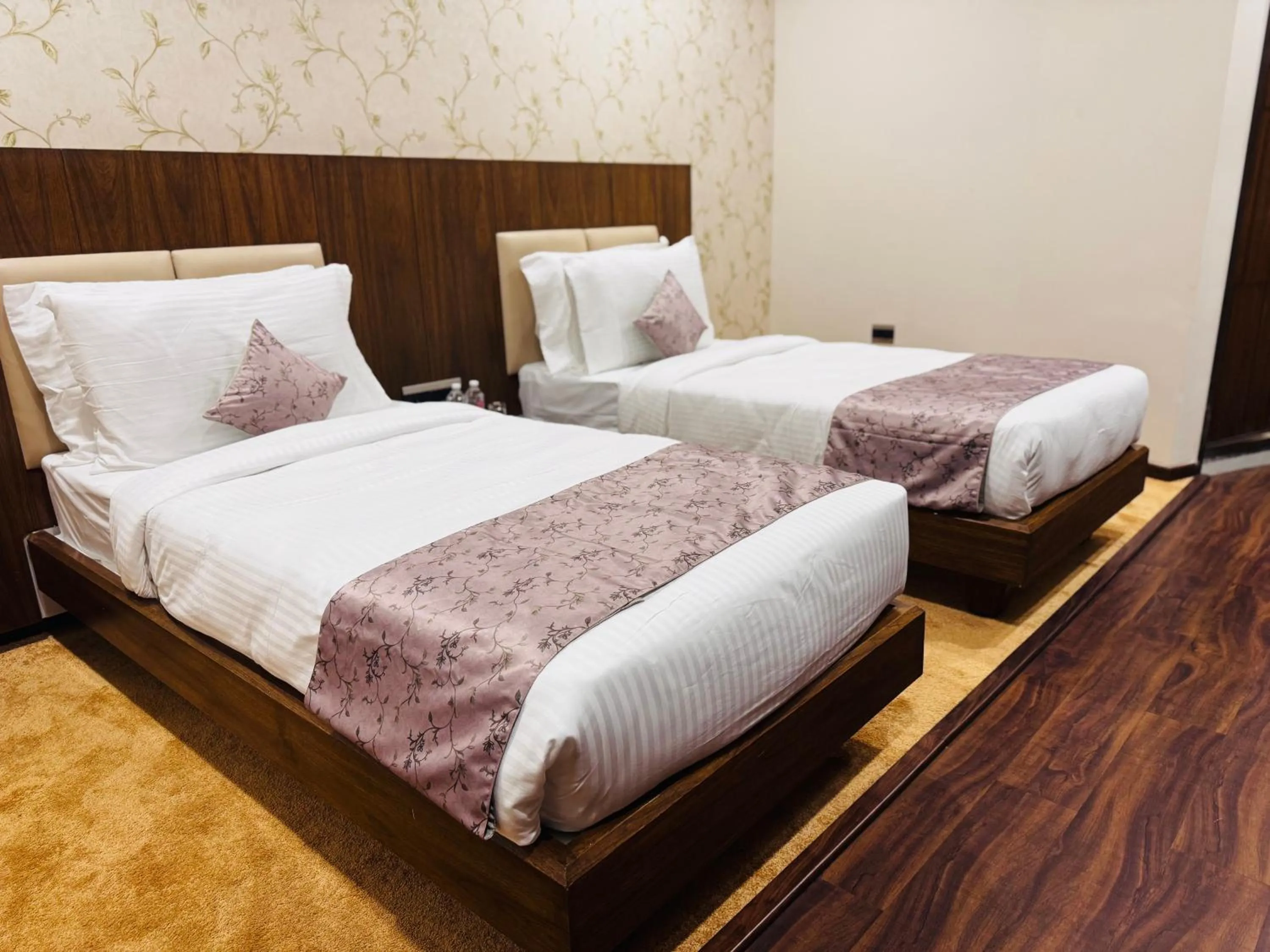 Bed in Pam Premium Hotel Vadodara
