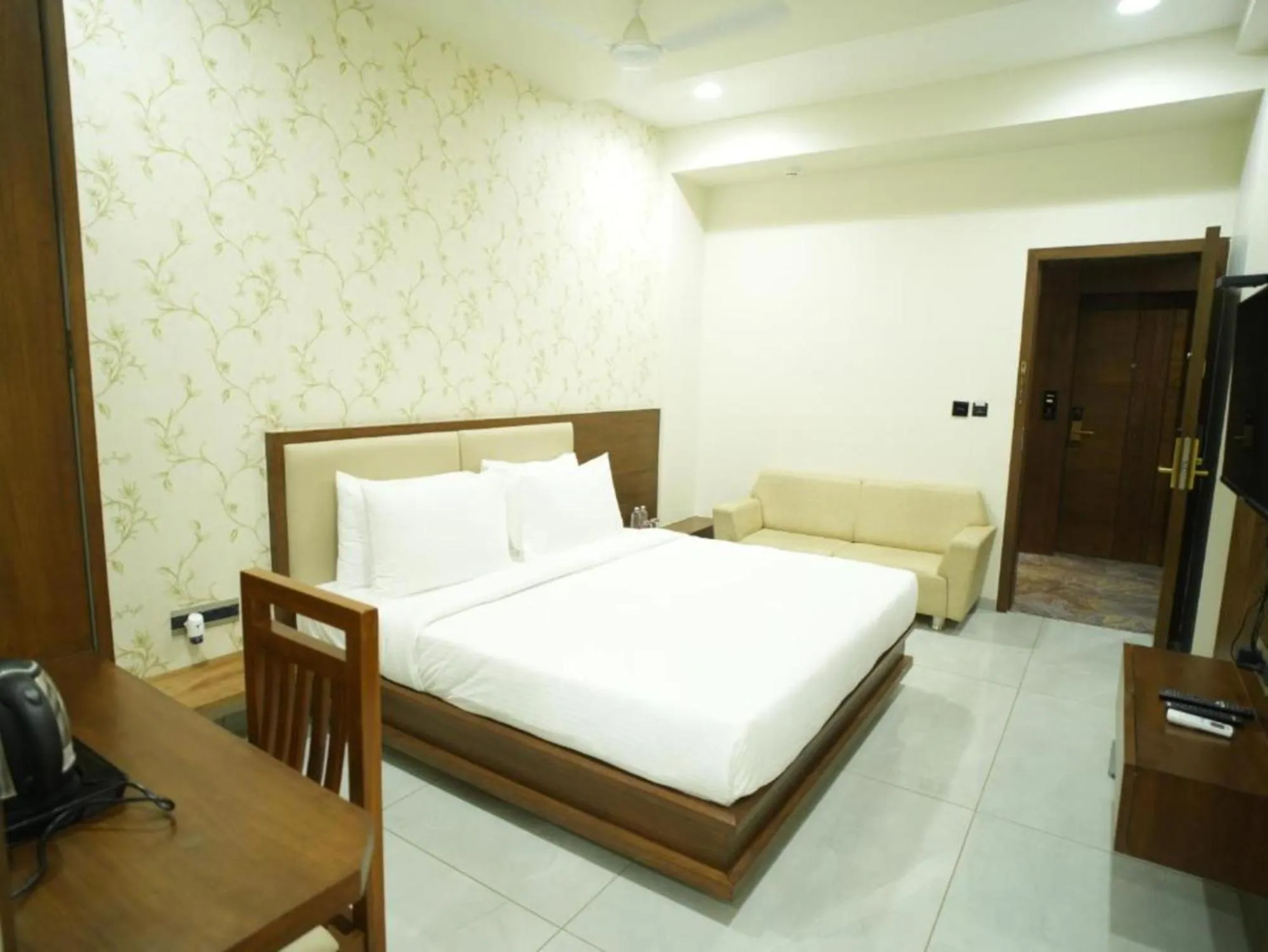 Bed in Pam Premium Hotel Vadodara