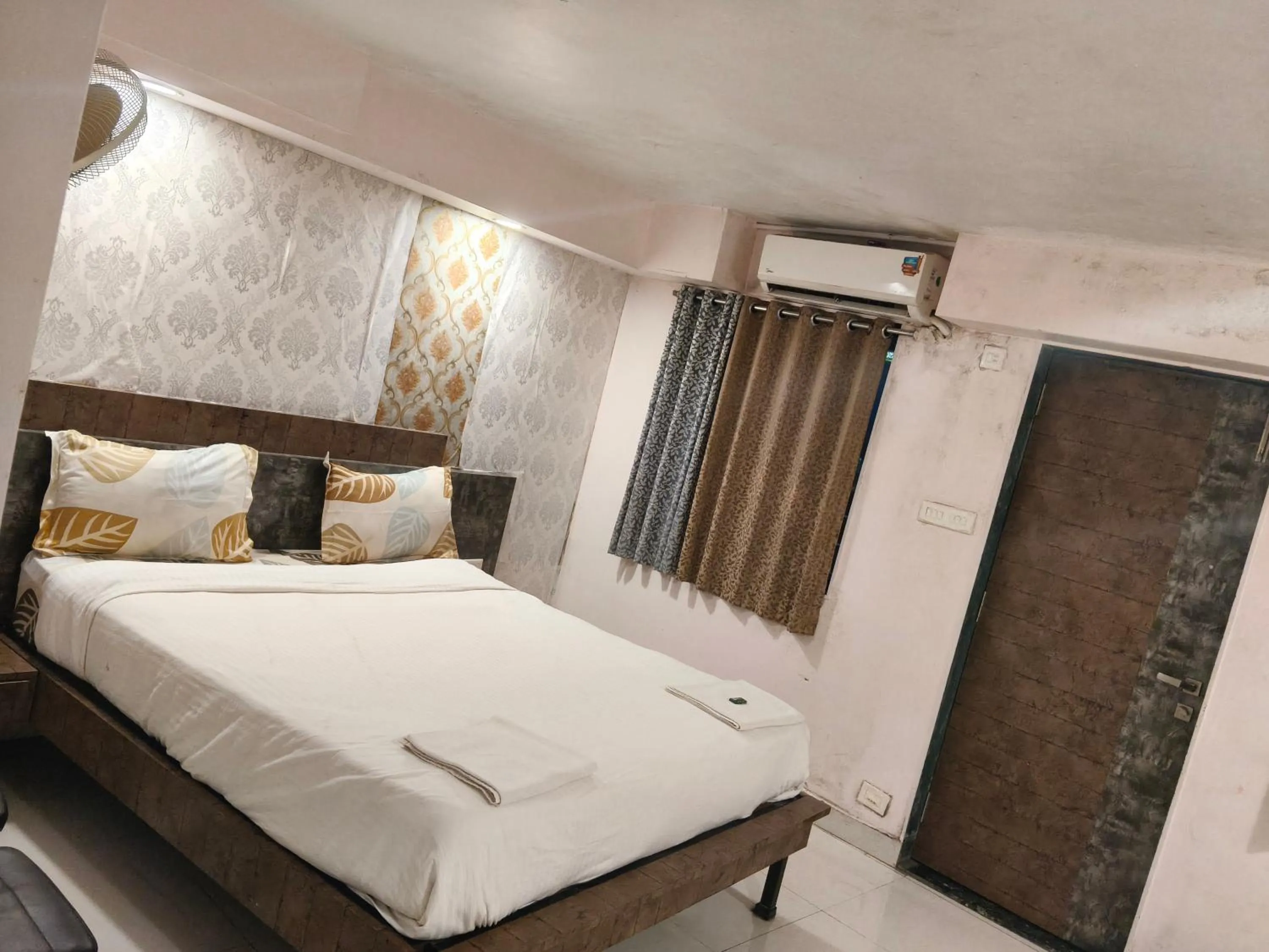 Bed in Hotel Laxmi Residency