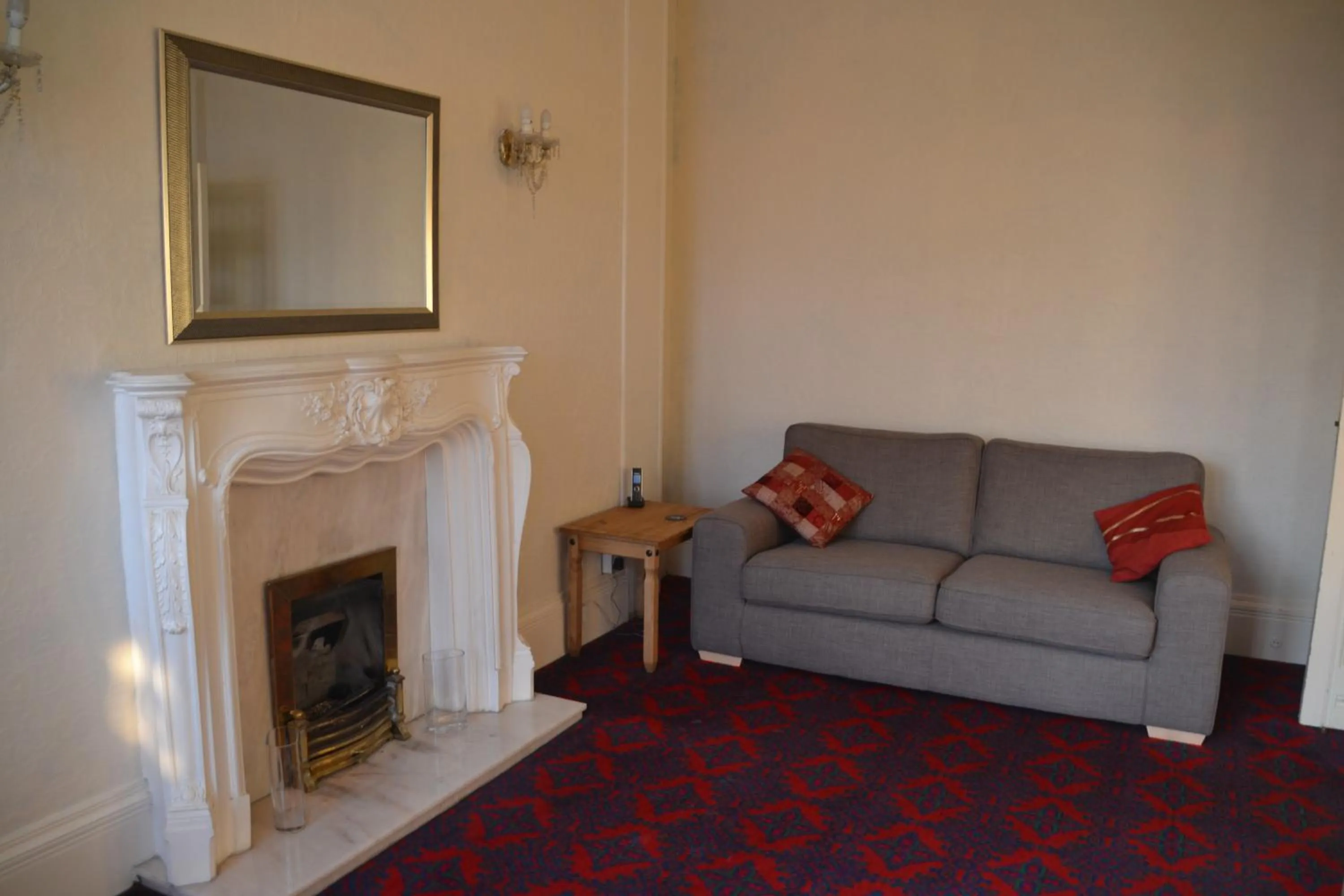 Communal lounge/ TV room in Camelot Seafront Hotel