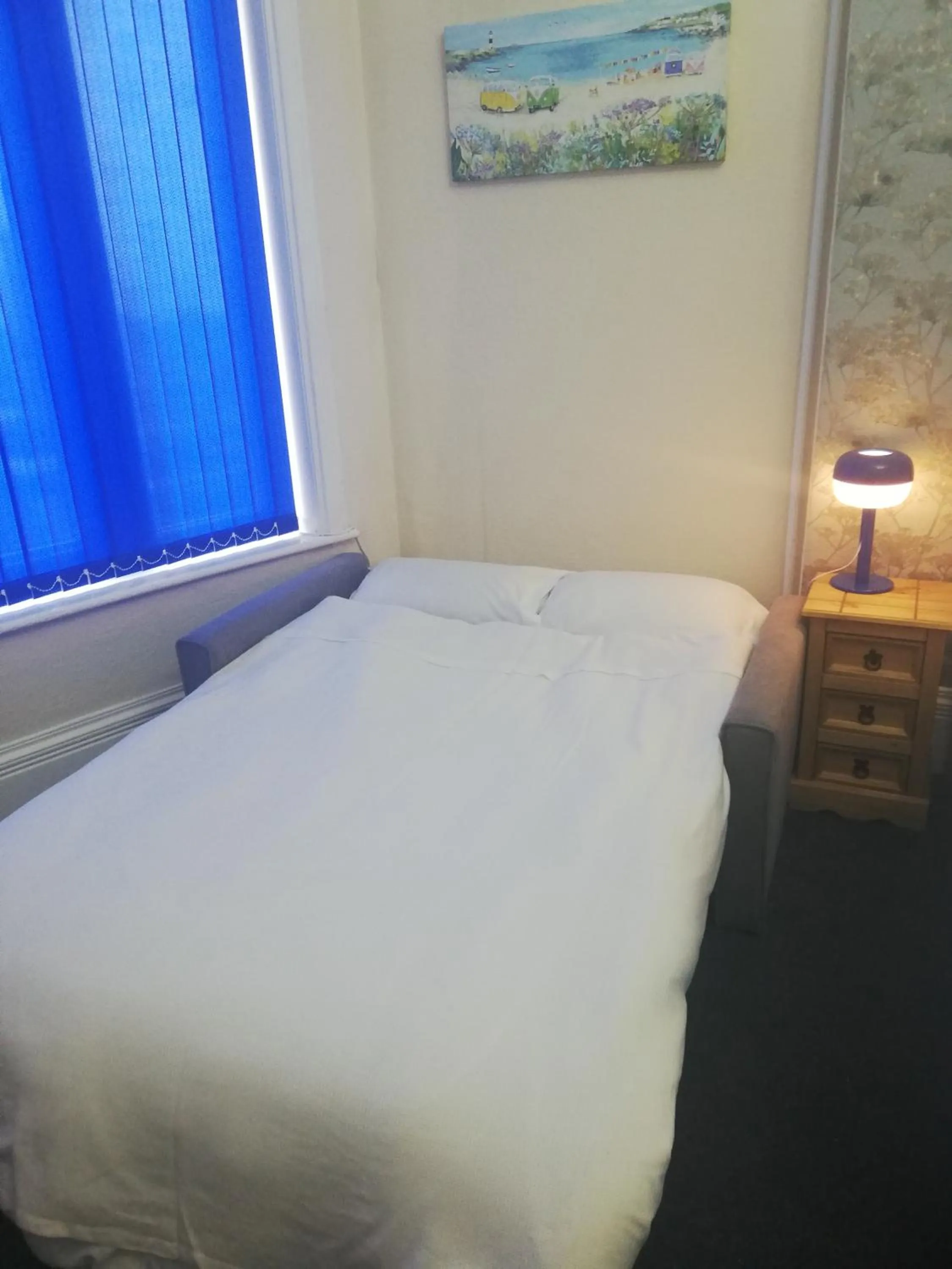 Bed in Camelot Seafront Hotel