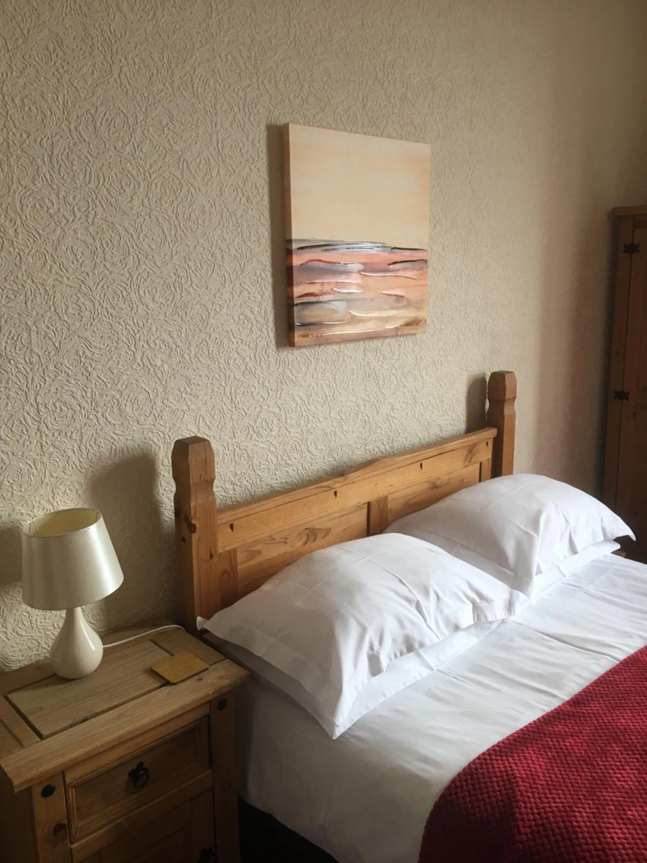 Bed in Camelot Seafront Hotel