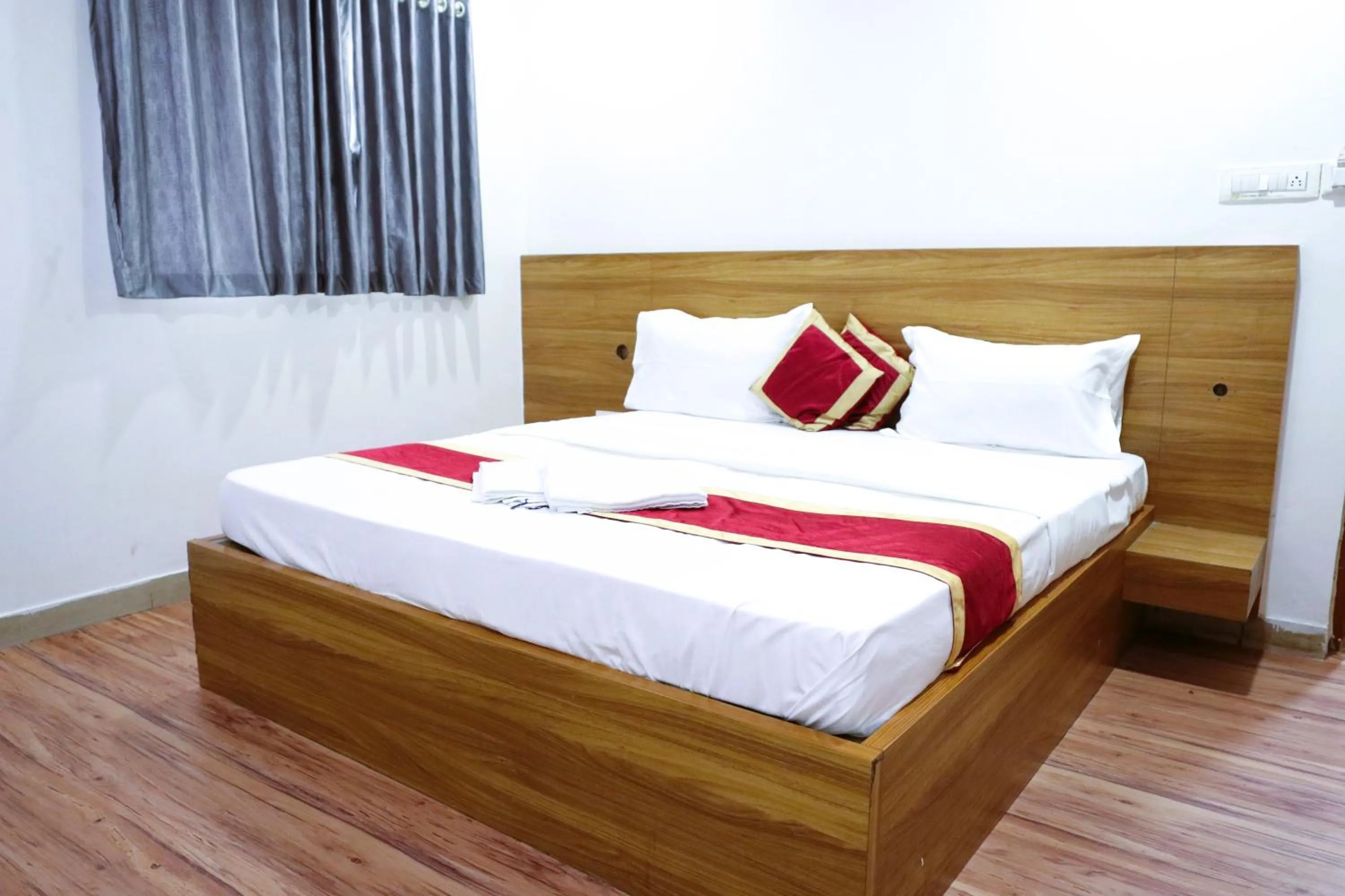 Bed in Sai Comforts Rooms