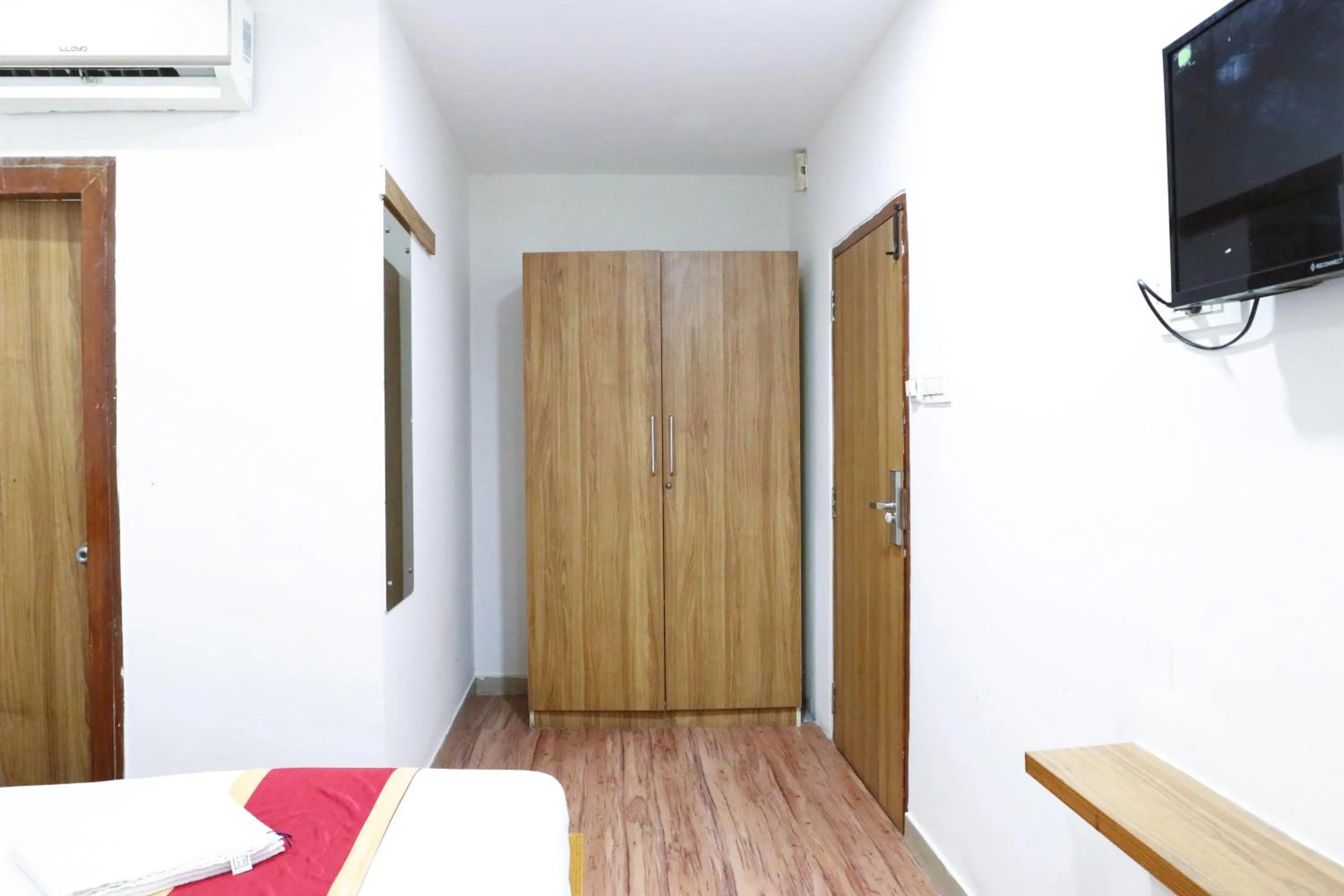 Bed in Sai Comforts Rooms