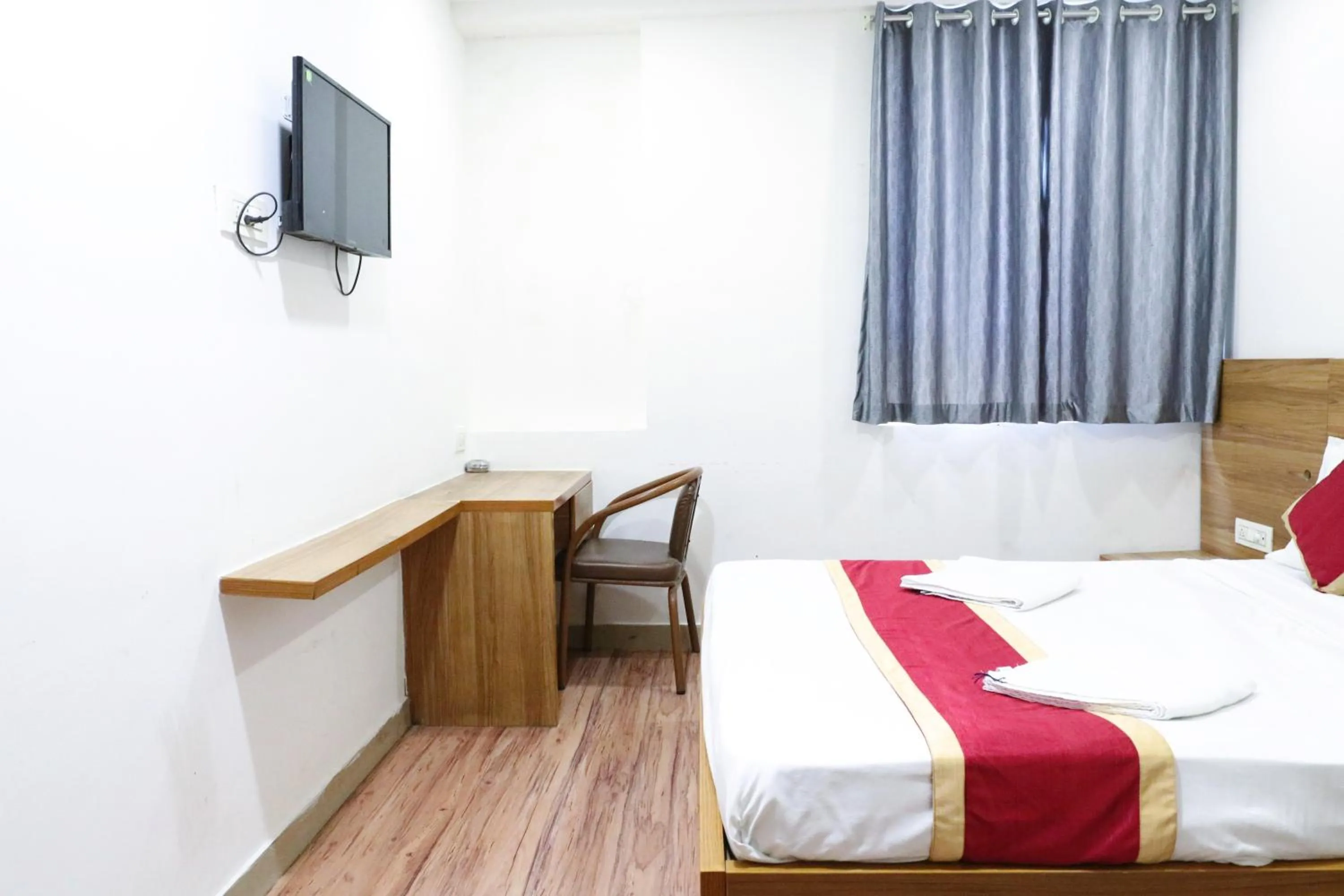 Bed in Sai Comforts Rooms