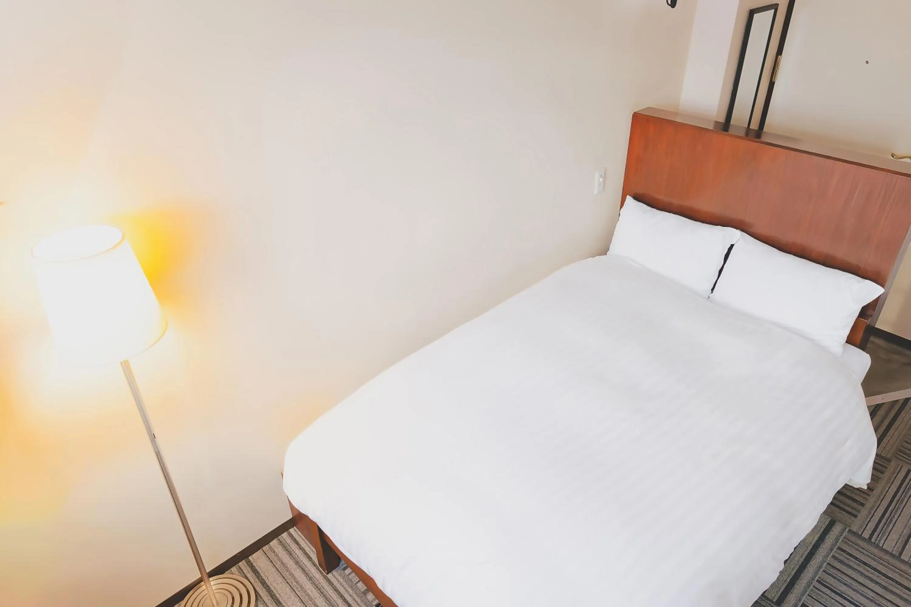 Bed in Van Cort Landt Hotel