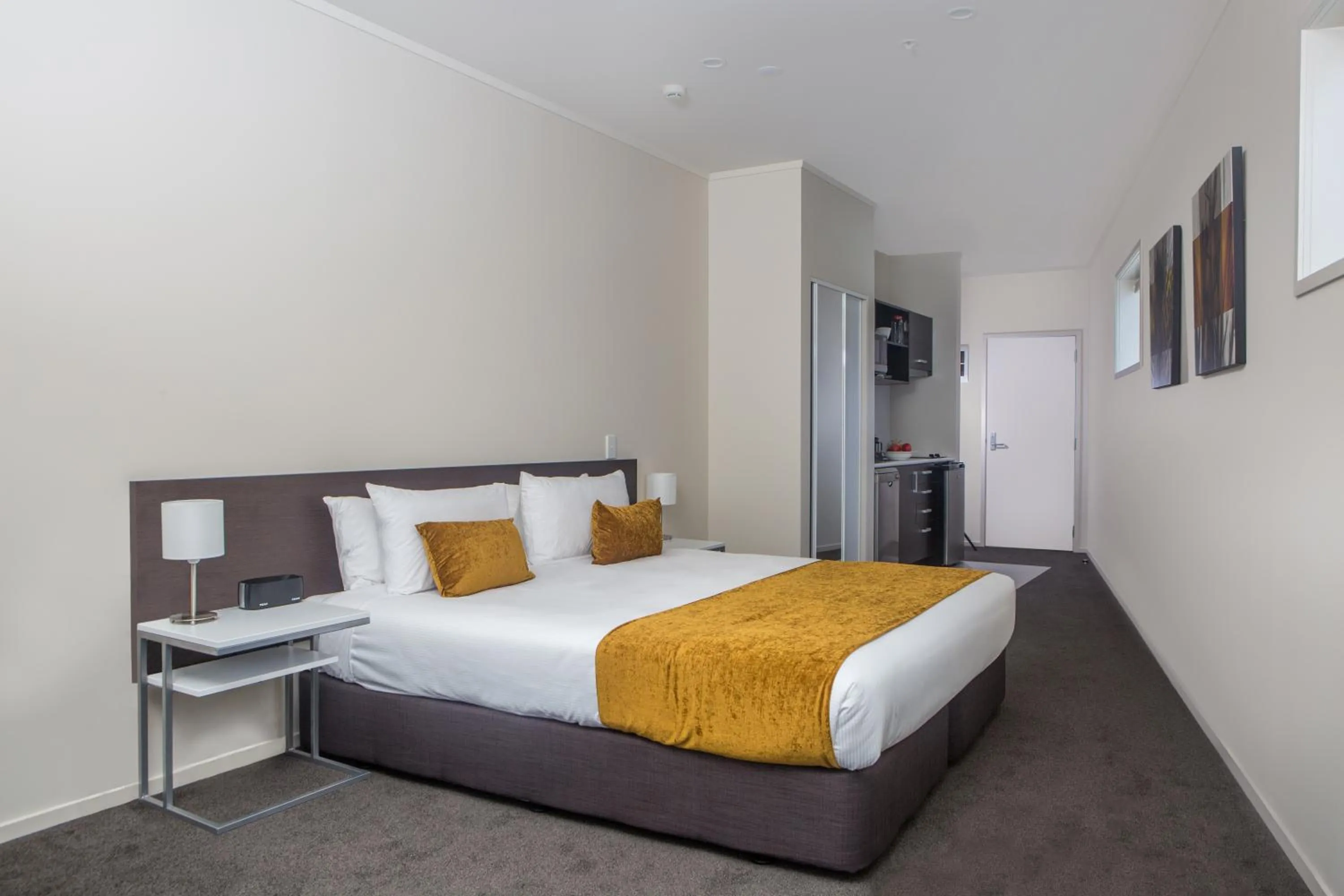 Kitchen or kitchenette, Bed in Quest Whangarei