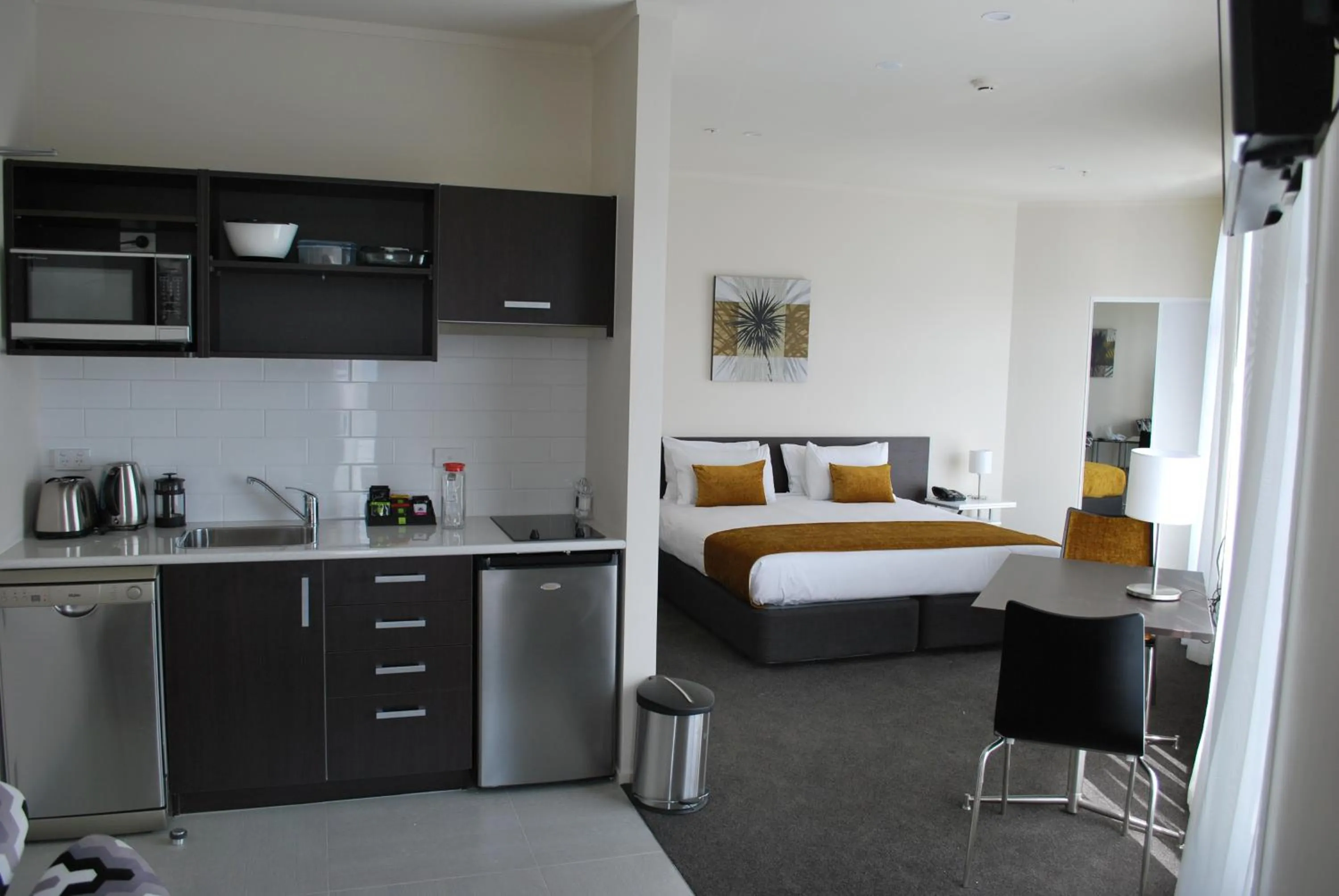 Living room, Bed in Quest Whangarei