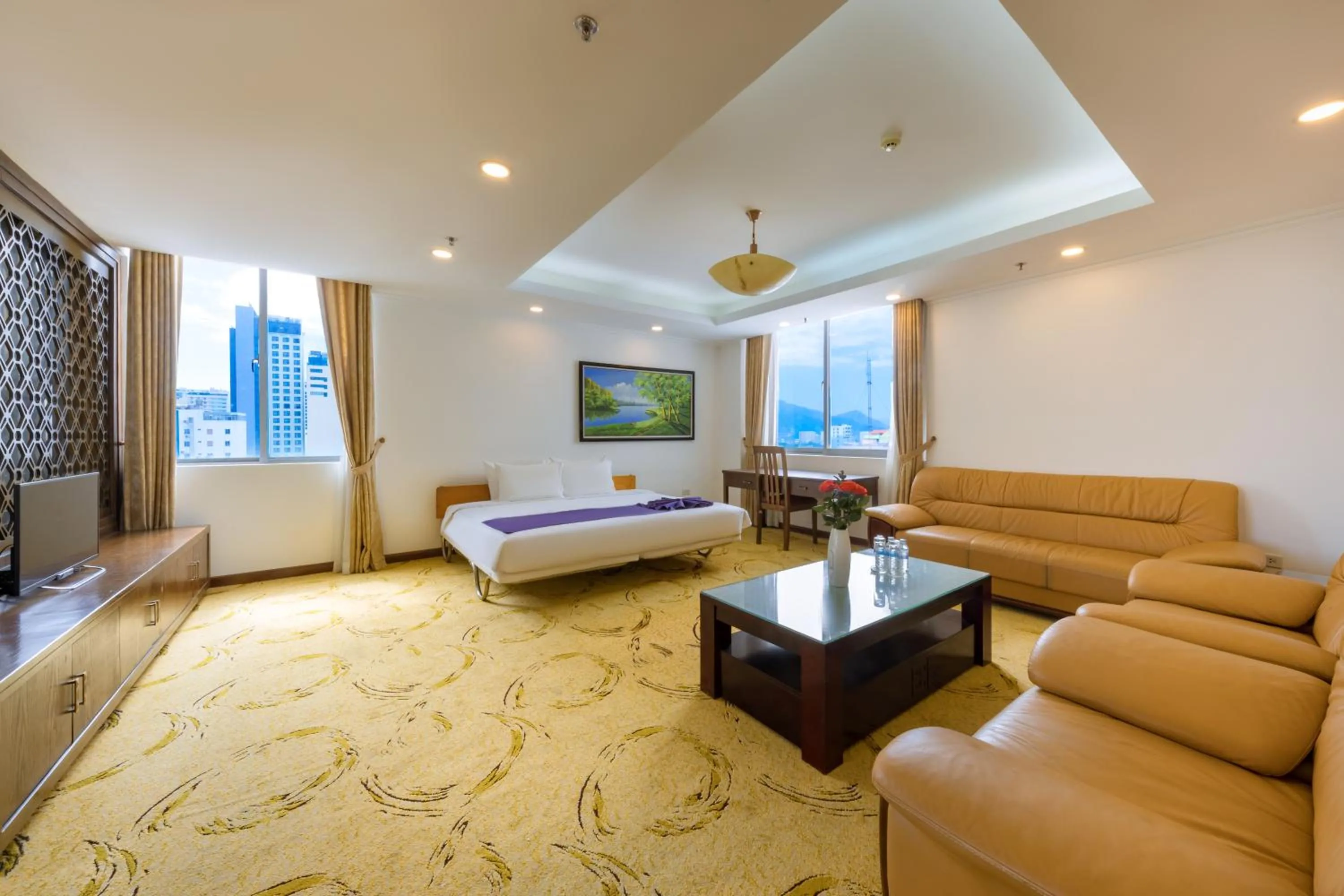 Communal lounge/ TV room, Bed in Central Nha Trang Hotel