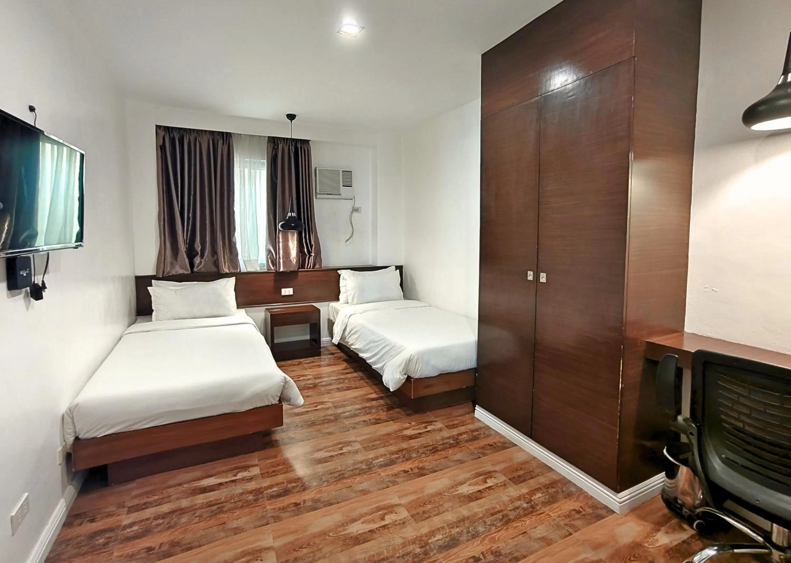 Bed in Ambien's Place Residential Hotel