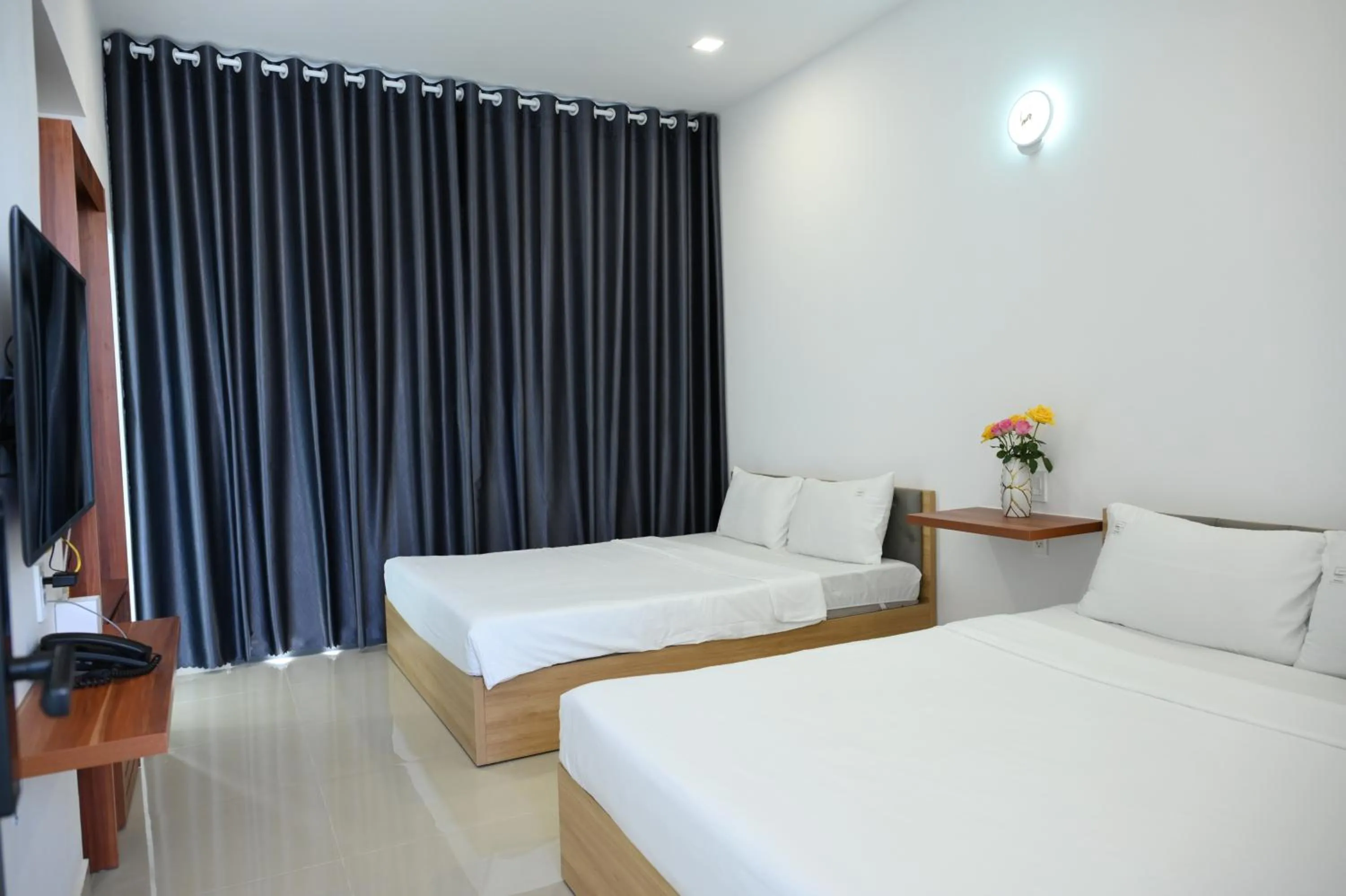 Bed in TalaSaiGon Hotel