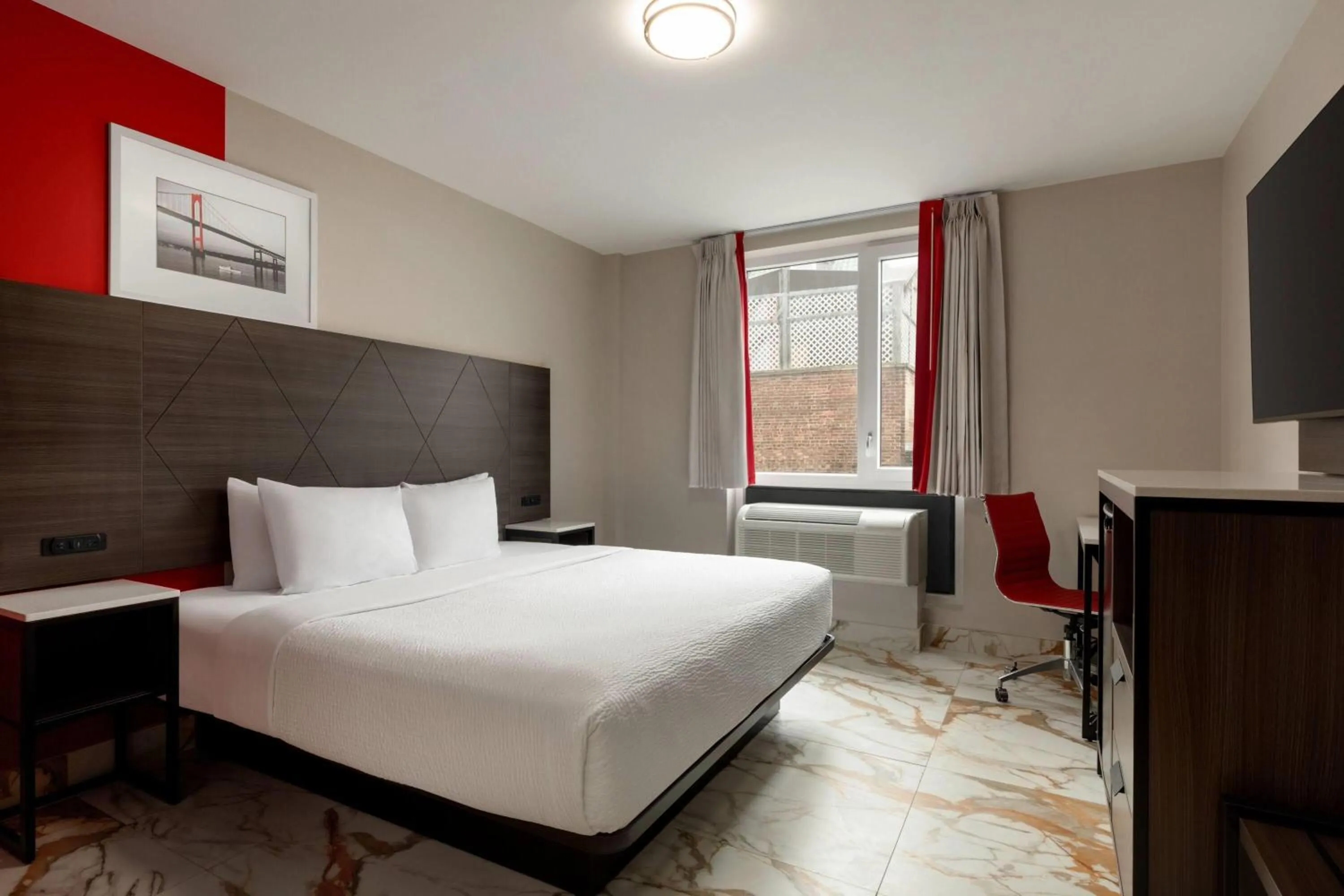 Photo of the whole room, Bed in Ramada by Wyndham Brooklyn Empire Blvd