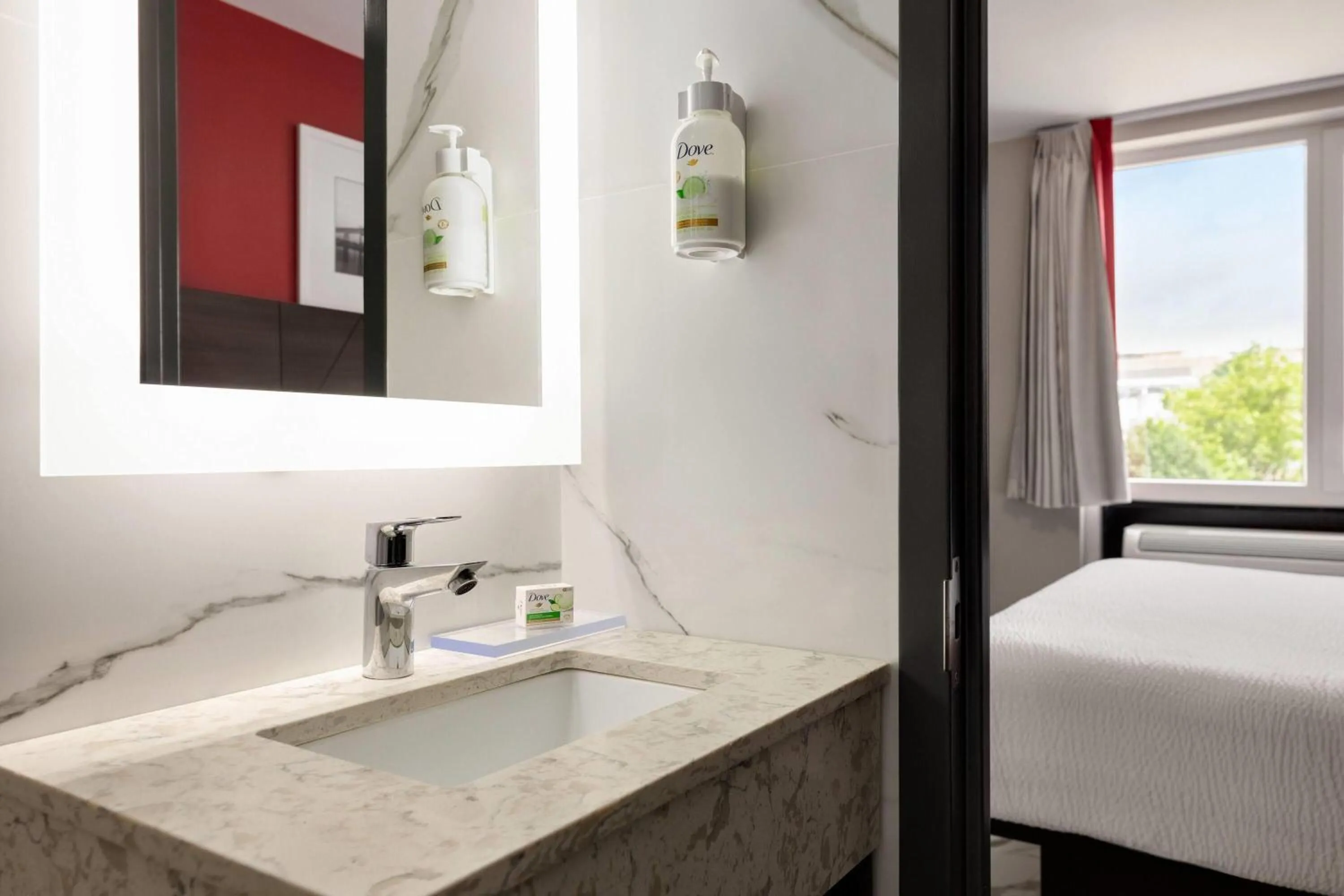 Bathroom, Bed in Ramada by Wyndham Brooklyn Empire Blvd