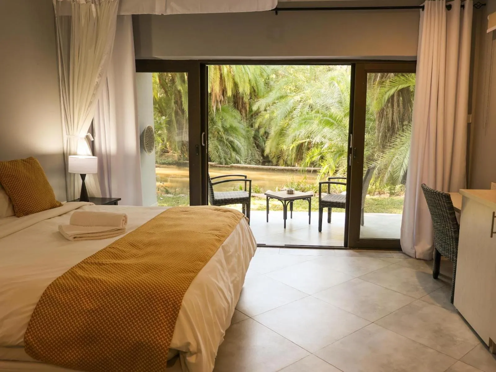 Photo of the whole room, Bed in The Victoria Falls Waterfront