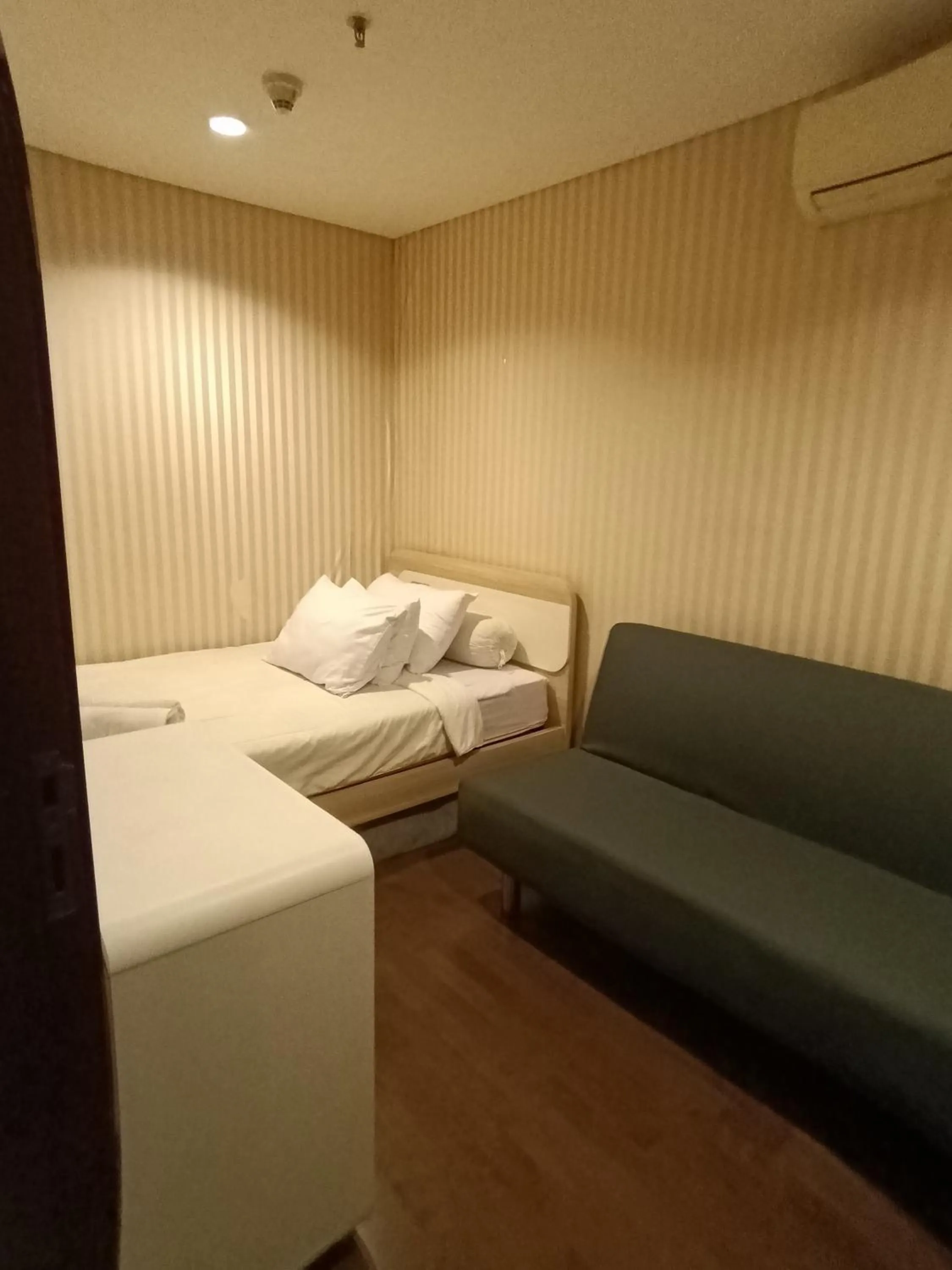 Bed in eL ROYALE by Farizi Rooms