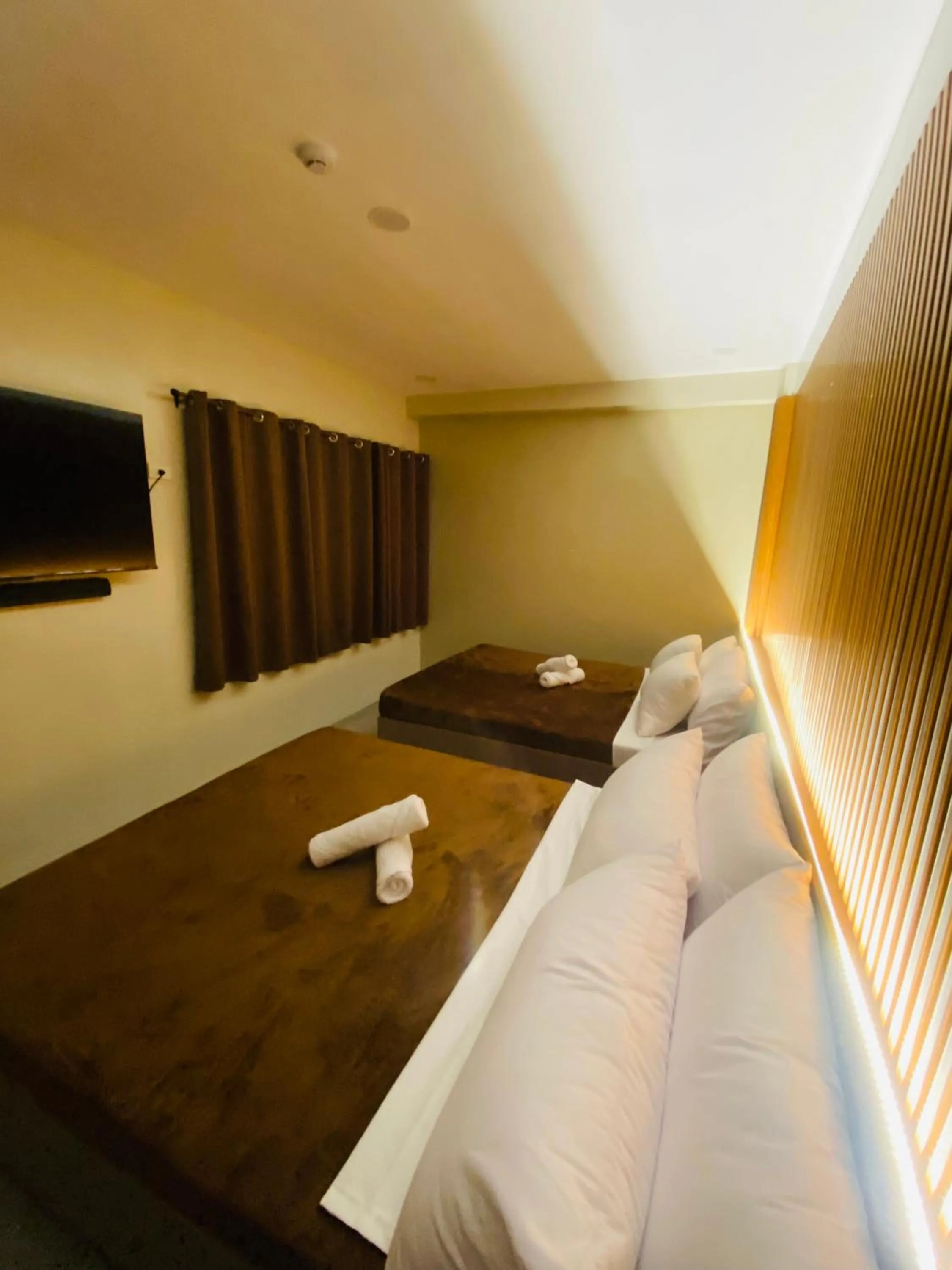 Bed in ZenSuites Hotel Tacloban