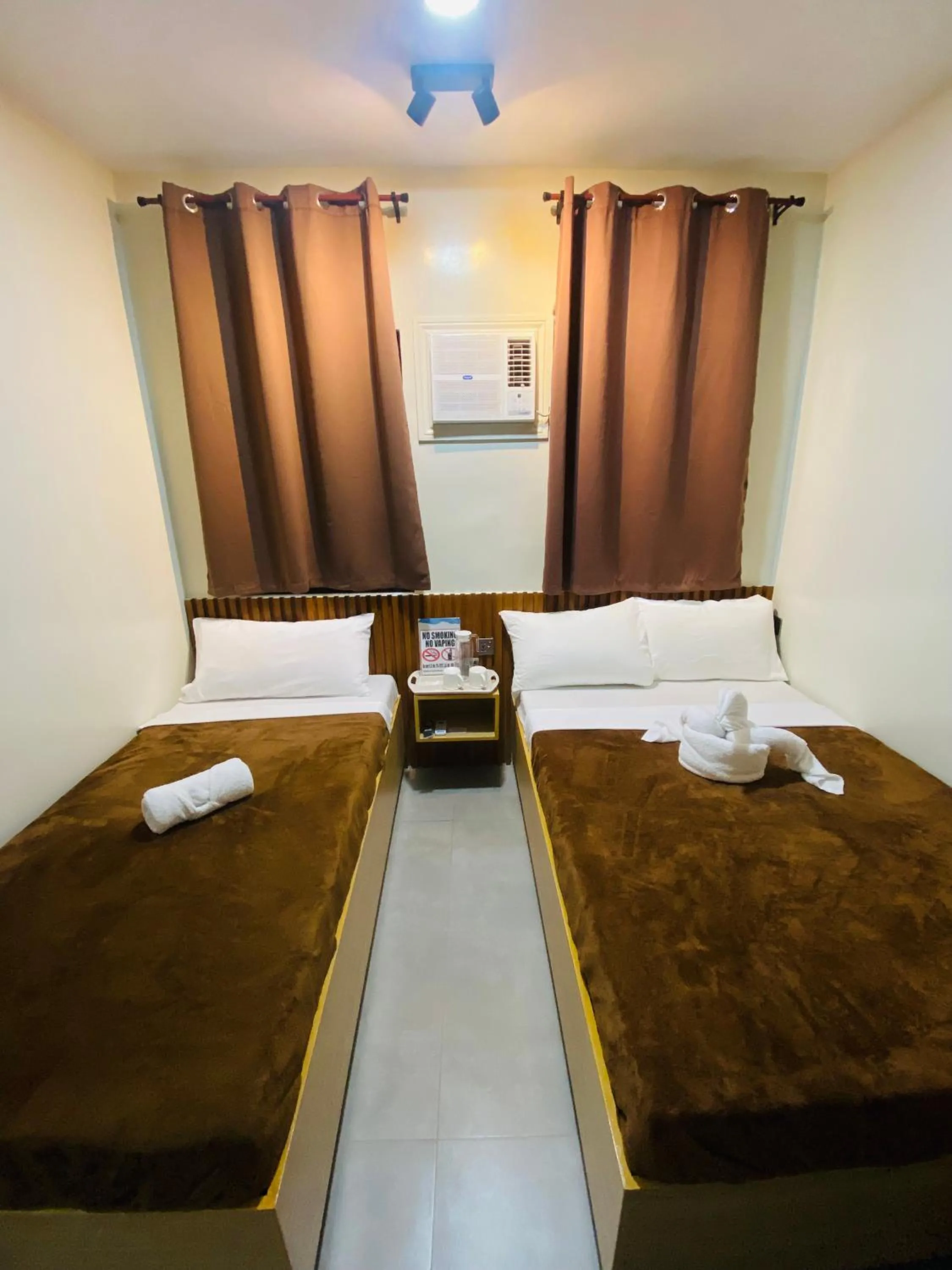 Bed in ZenSuites Hotel Tacloban