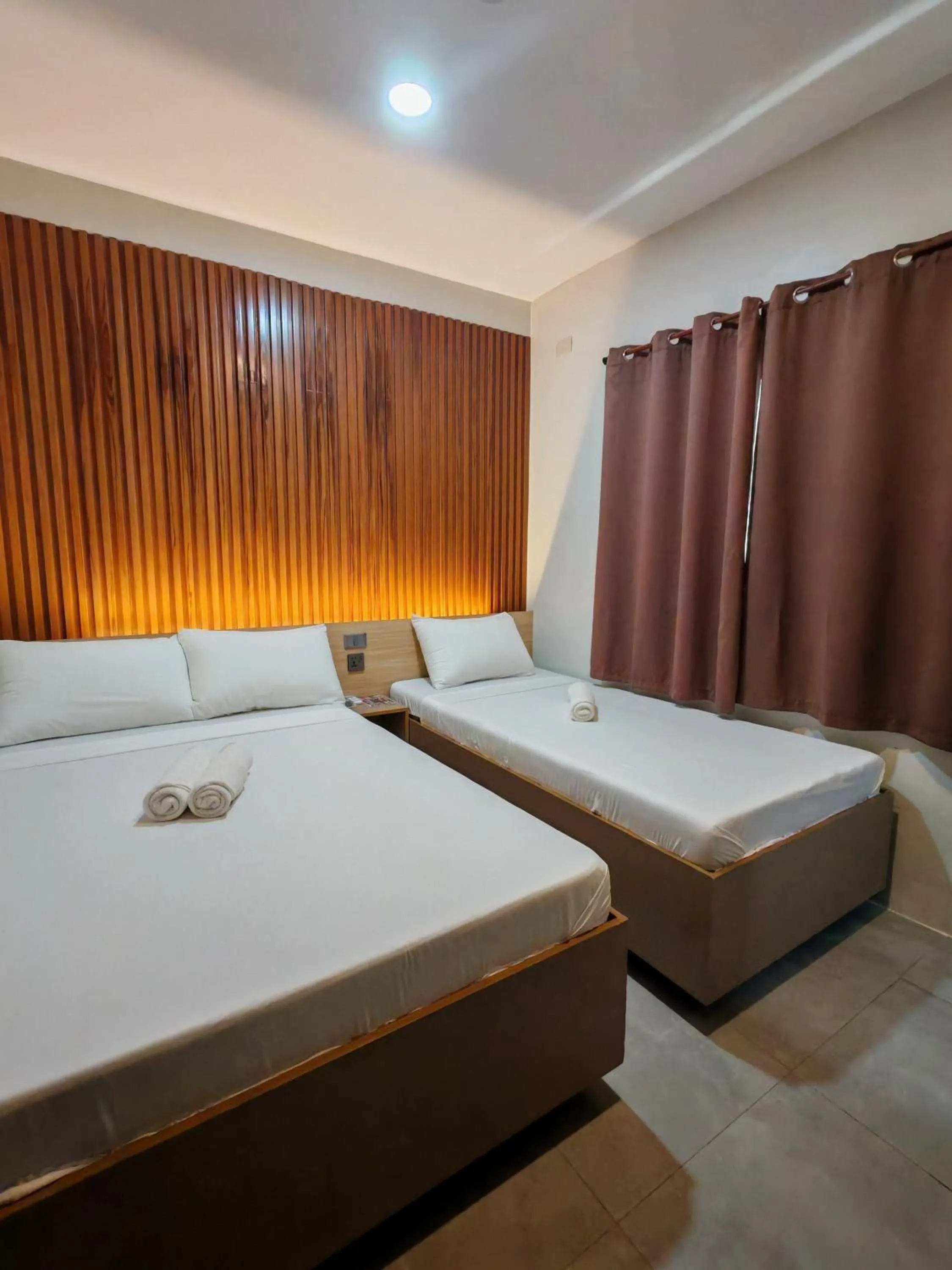 Bed in ZenSuites Hotel Tacloban