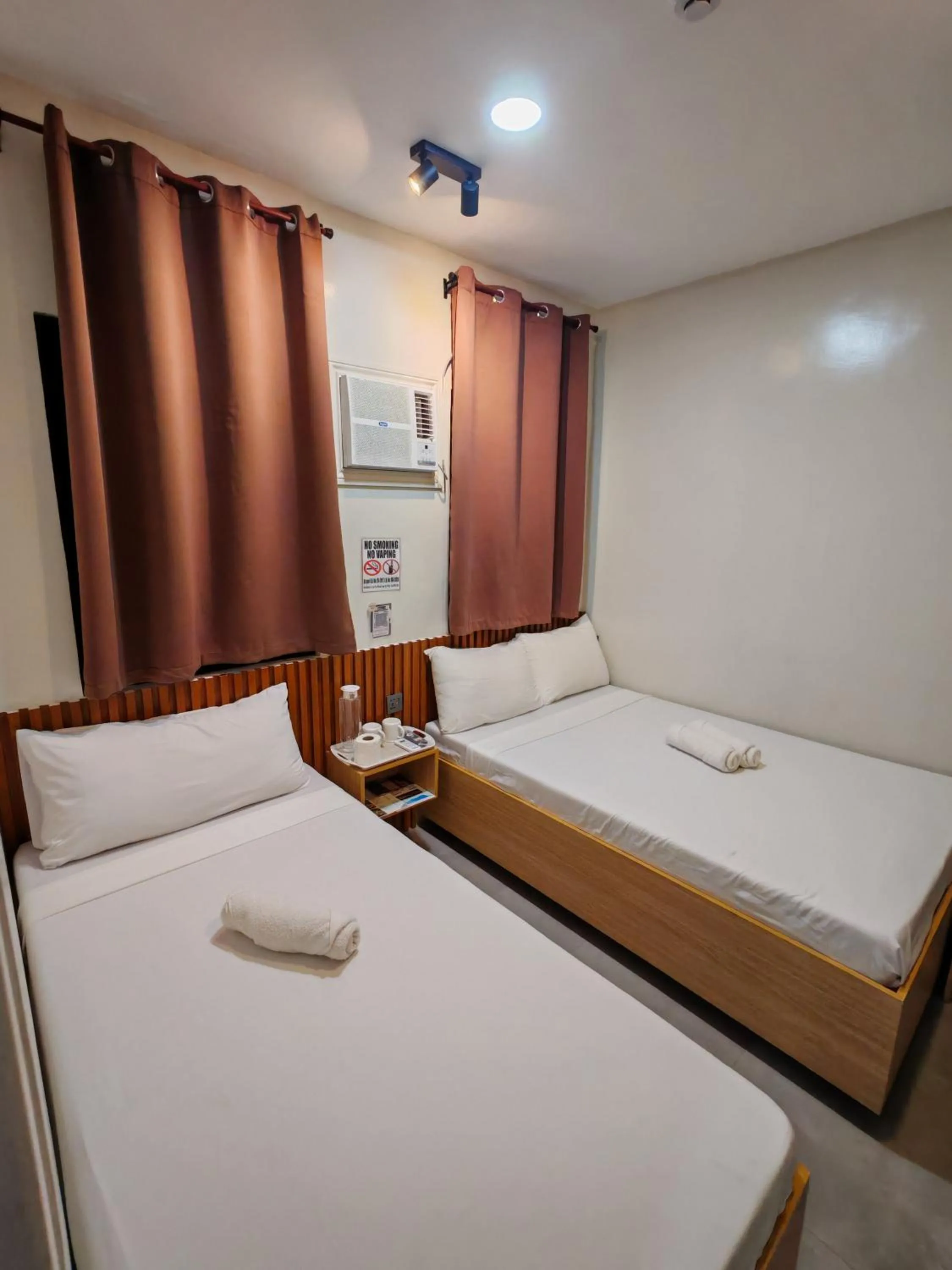 Bed in ZenSuites Hotel Tacloban