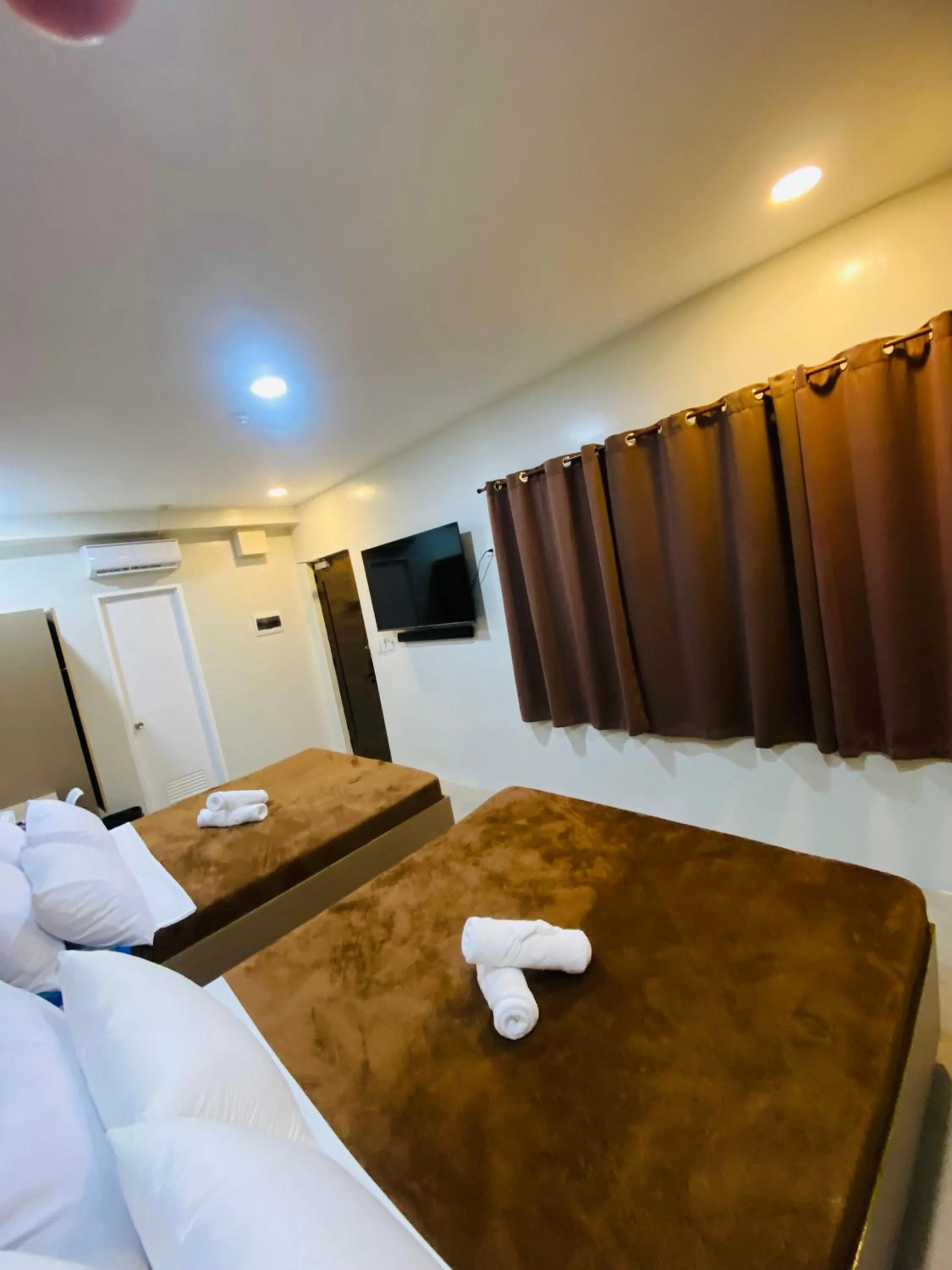 Bed in ZenSuites Hotel Tacloban