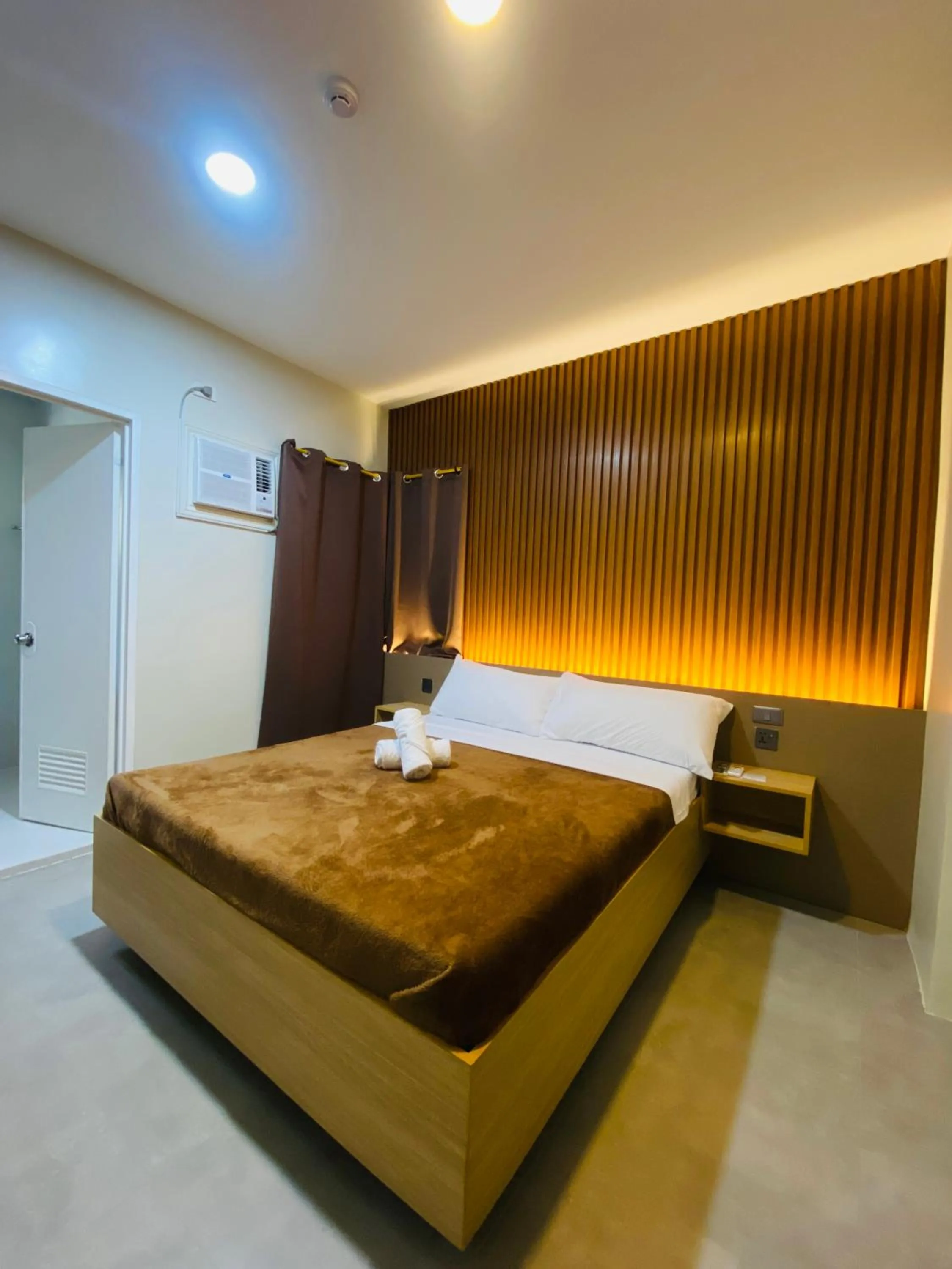 Bed in ZenSuites Hotel Tacloban