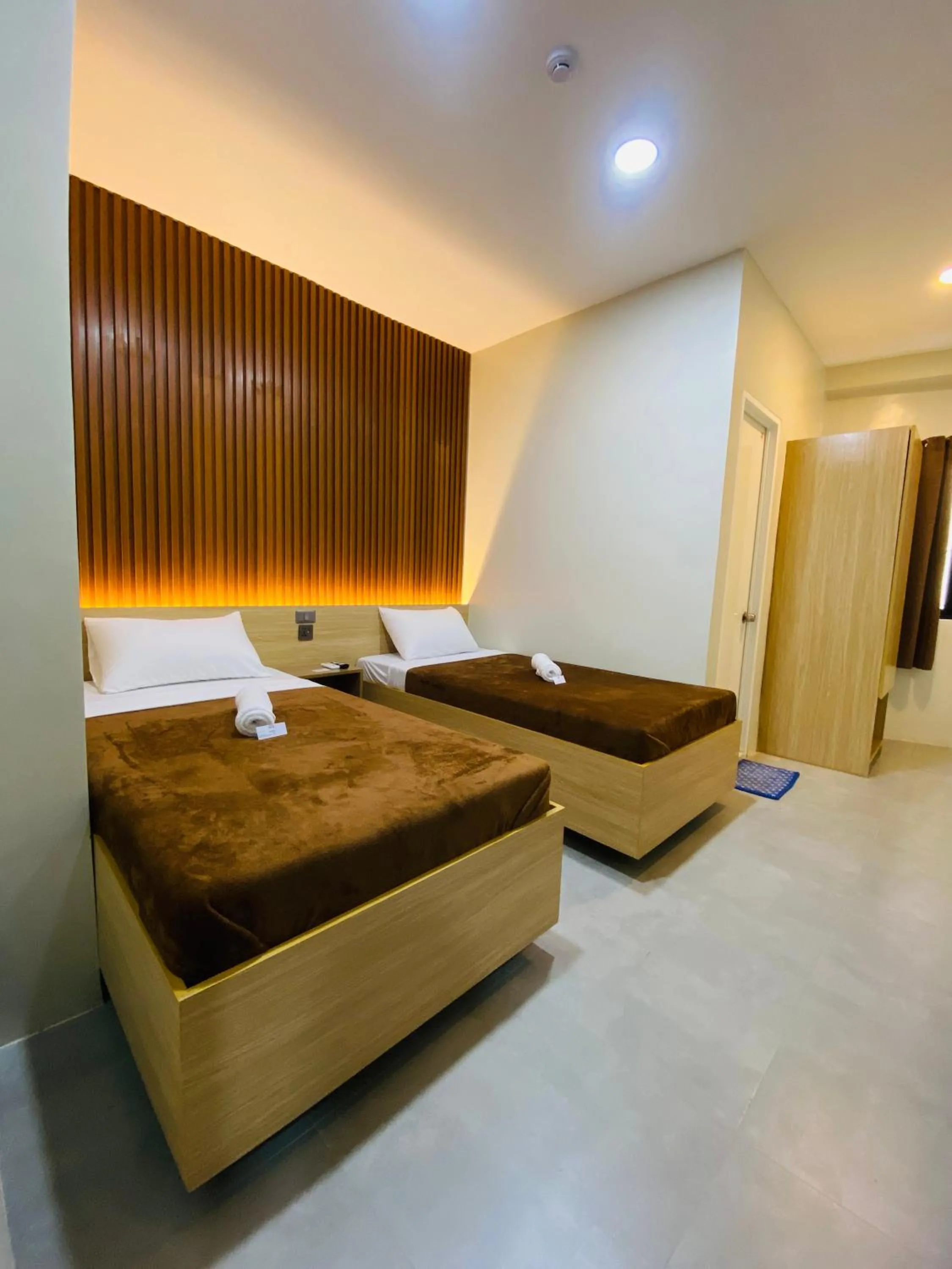 Bed in ZenSuites Hotel Tacloban