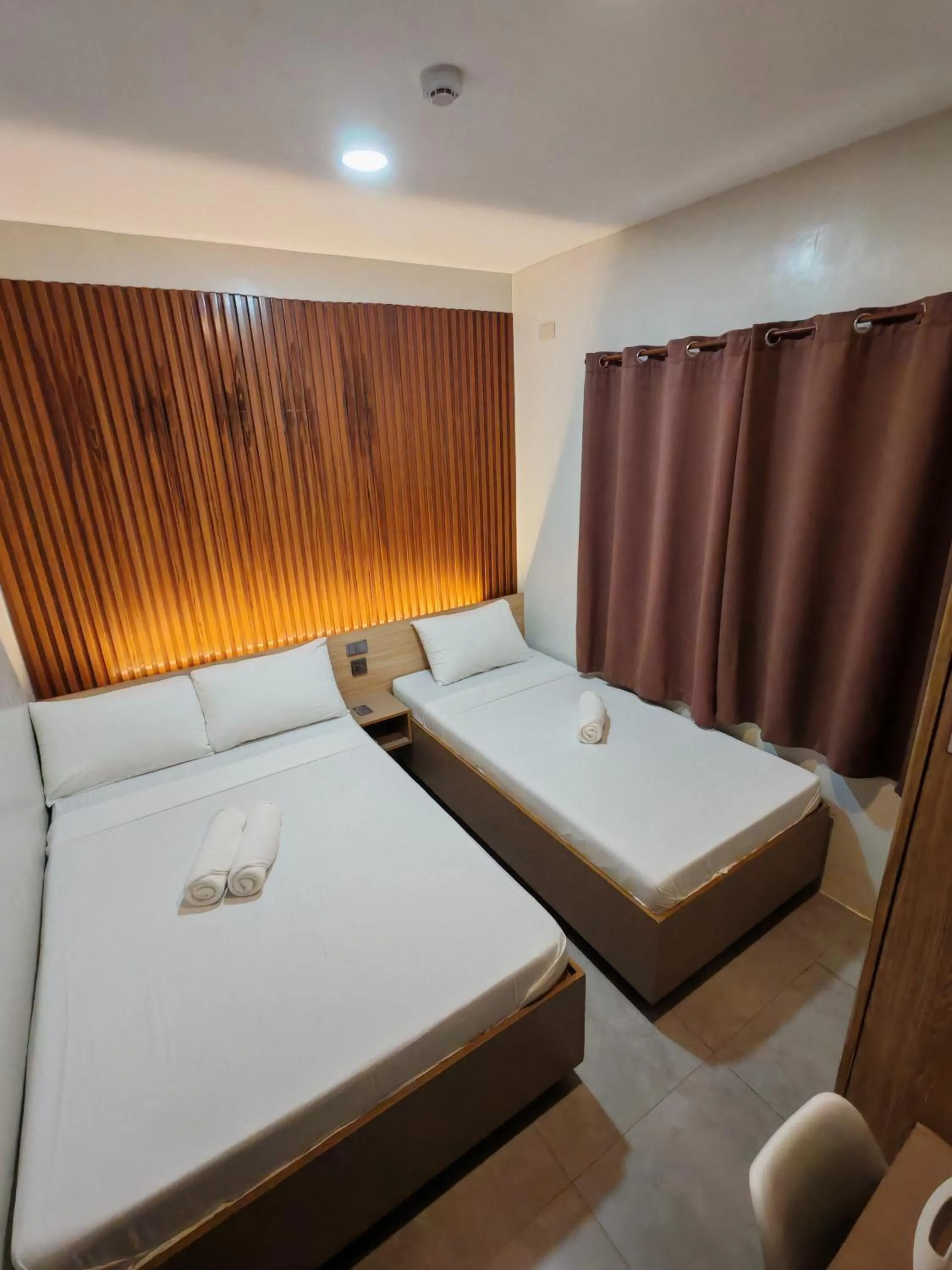 Bed in ZenSuites Hotel Tacloban