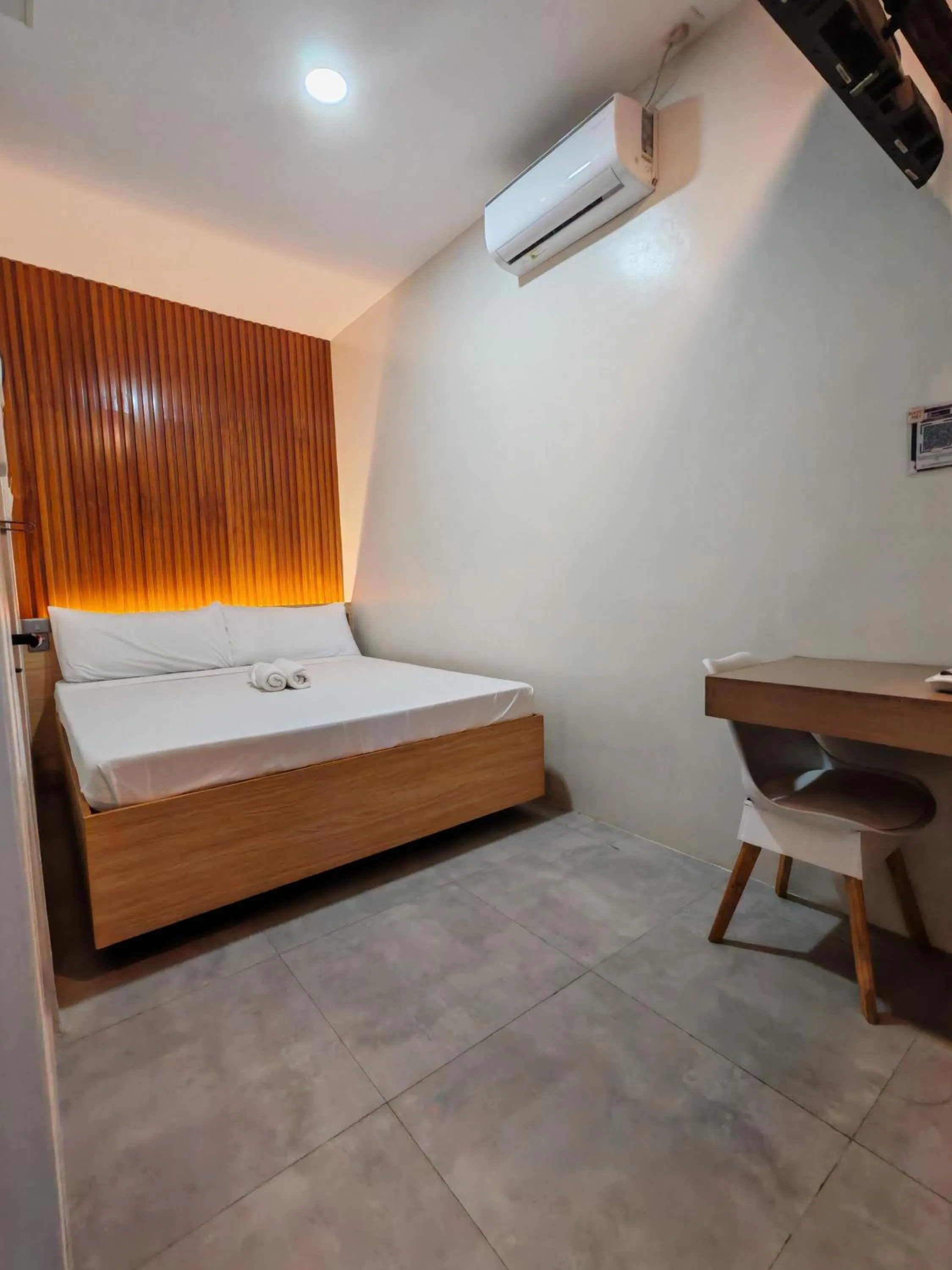 air conditioner, Bed in ZenSuites Hotel Tacloban