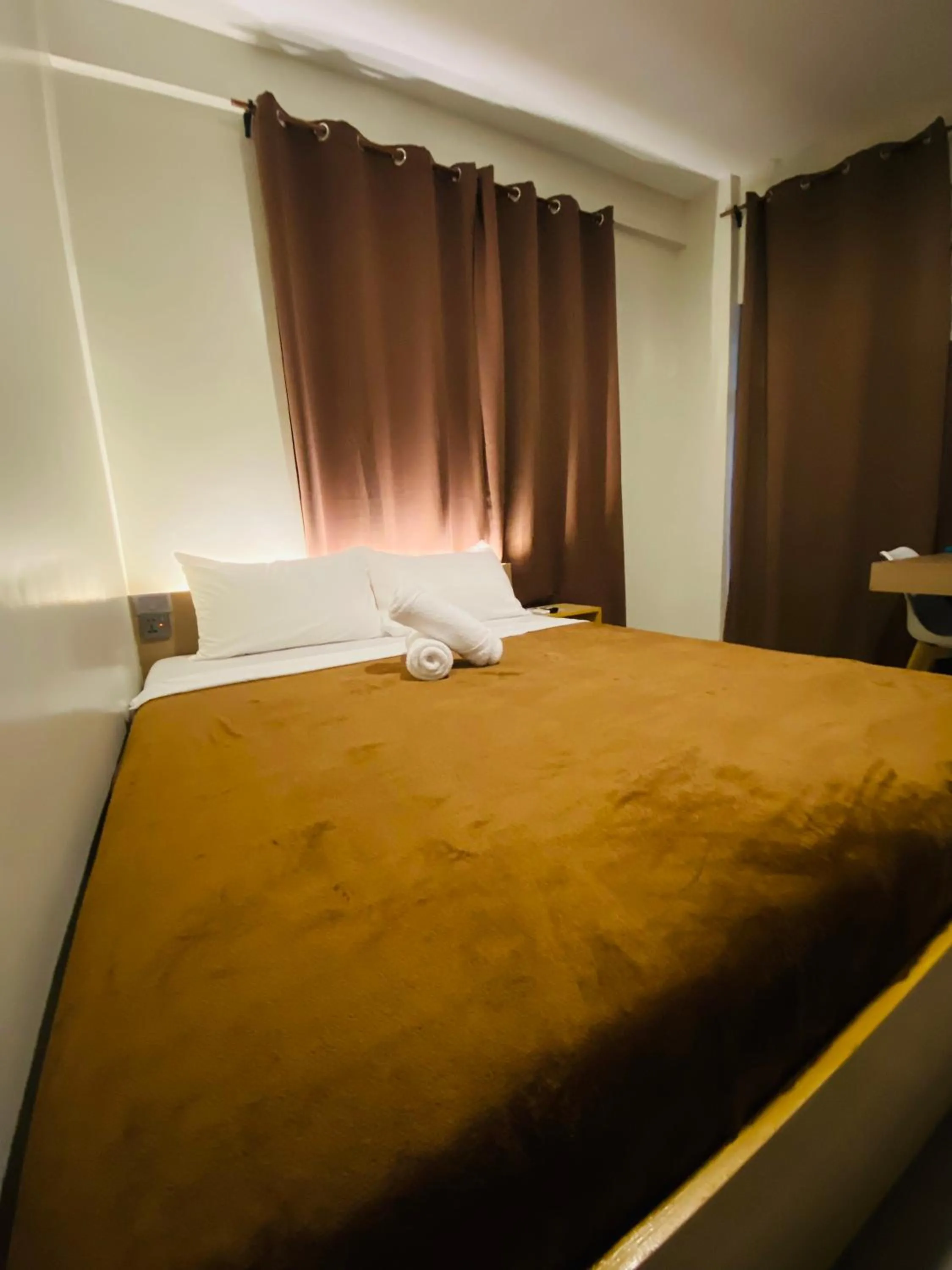 Bed in ZenSuites Hotel Tacloban