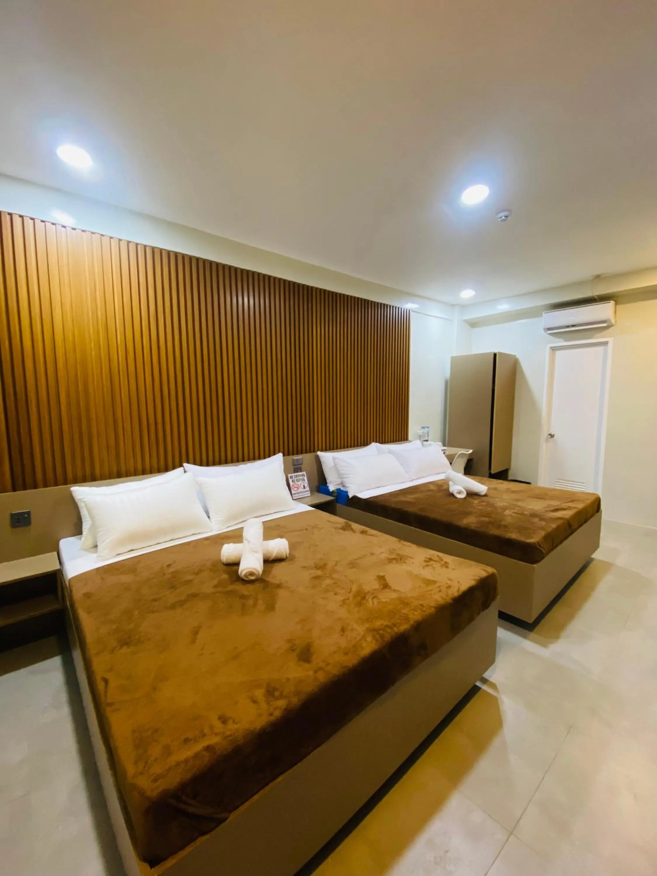 Bed in ZenSuites Hotel Tacloban