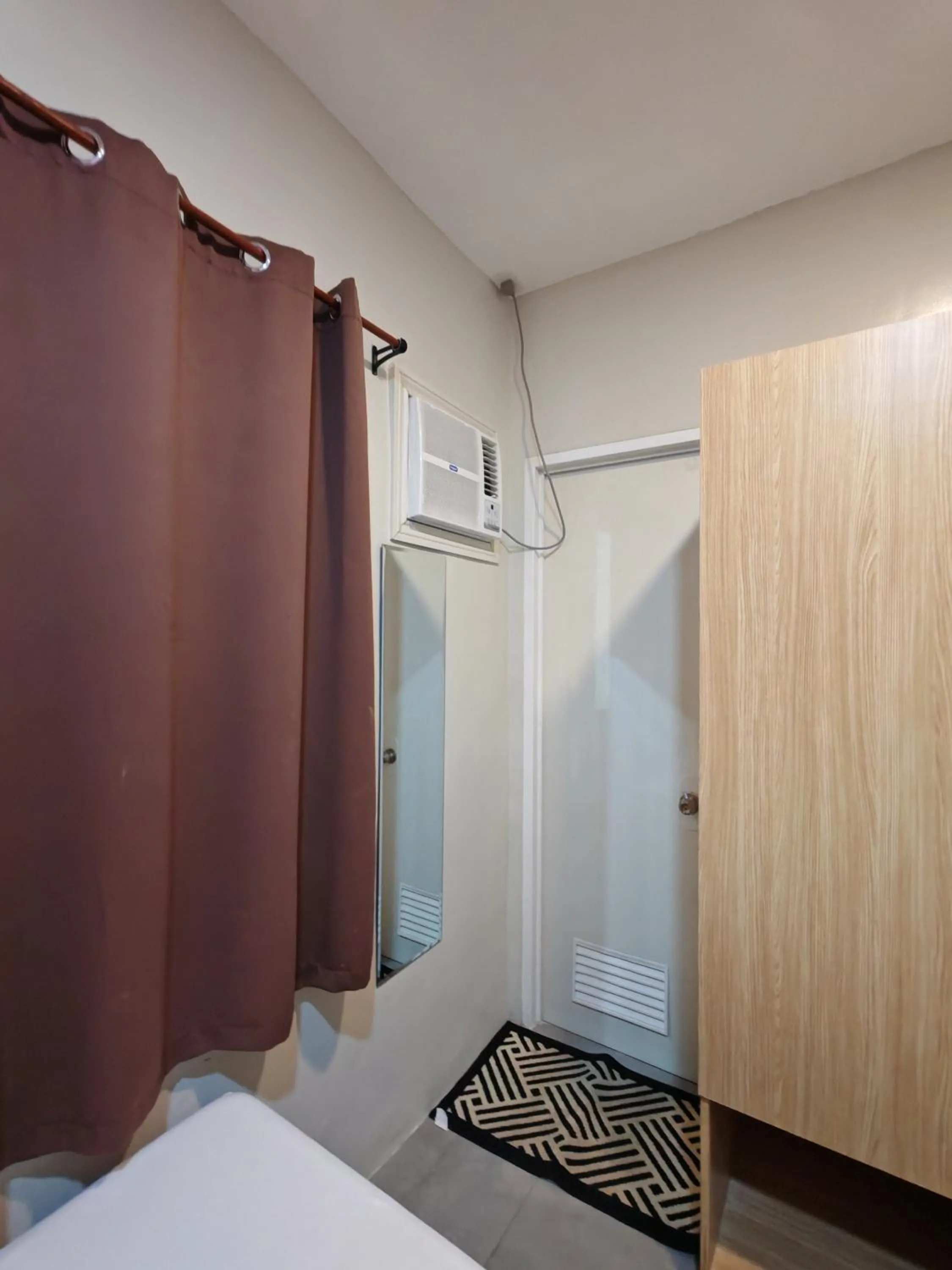 air conditioner, Bed in ZenSuites Hotel Tacloban