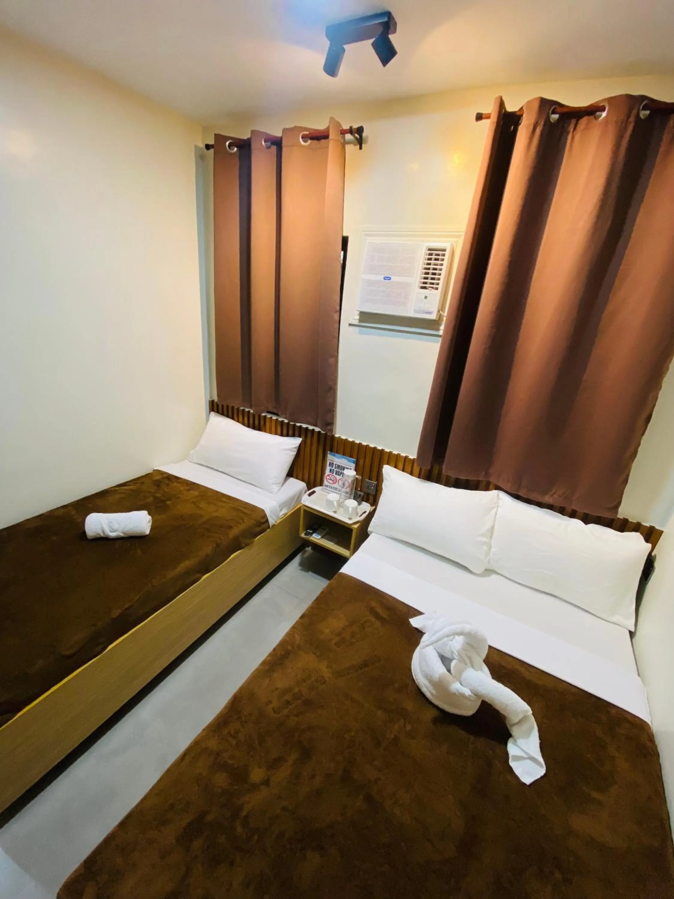 Bed in ZenSuites Hotel Tacloban