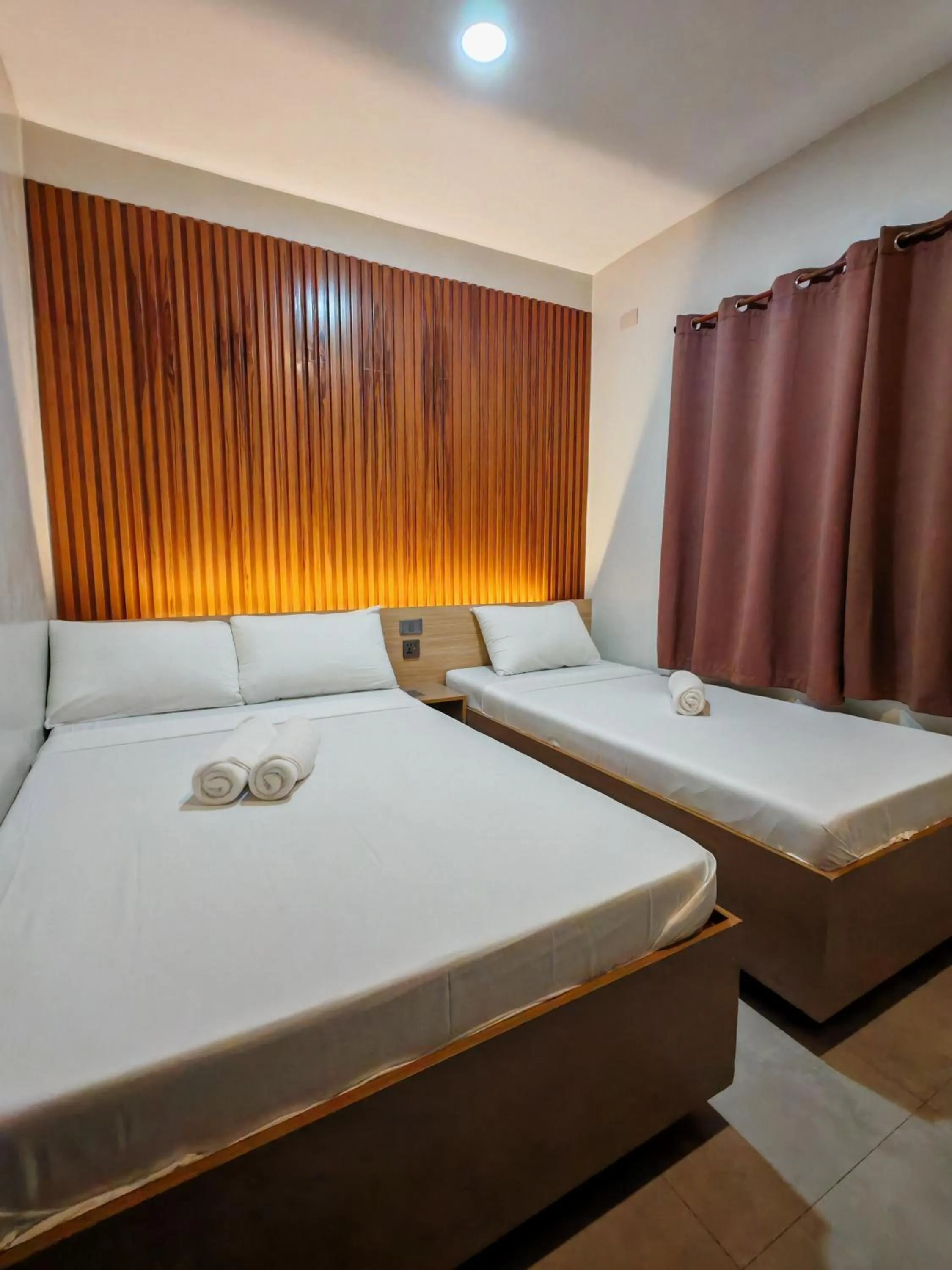 Bed in ZenSuites Hotel Tacloban