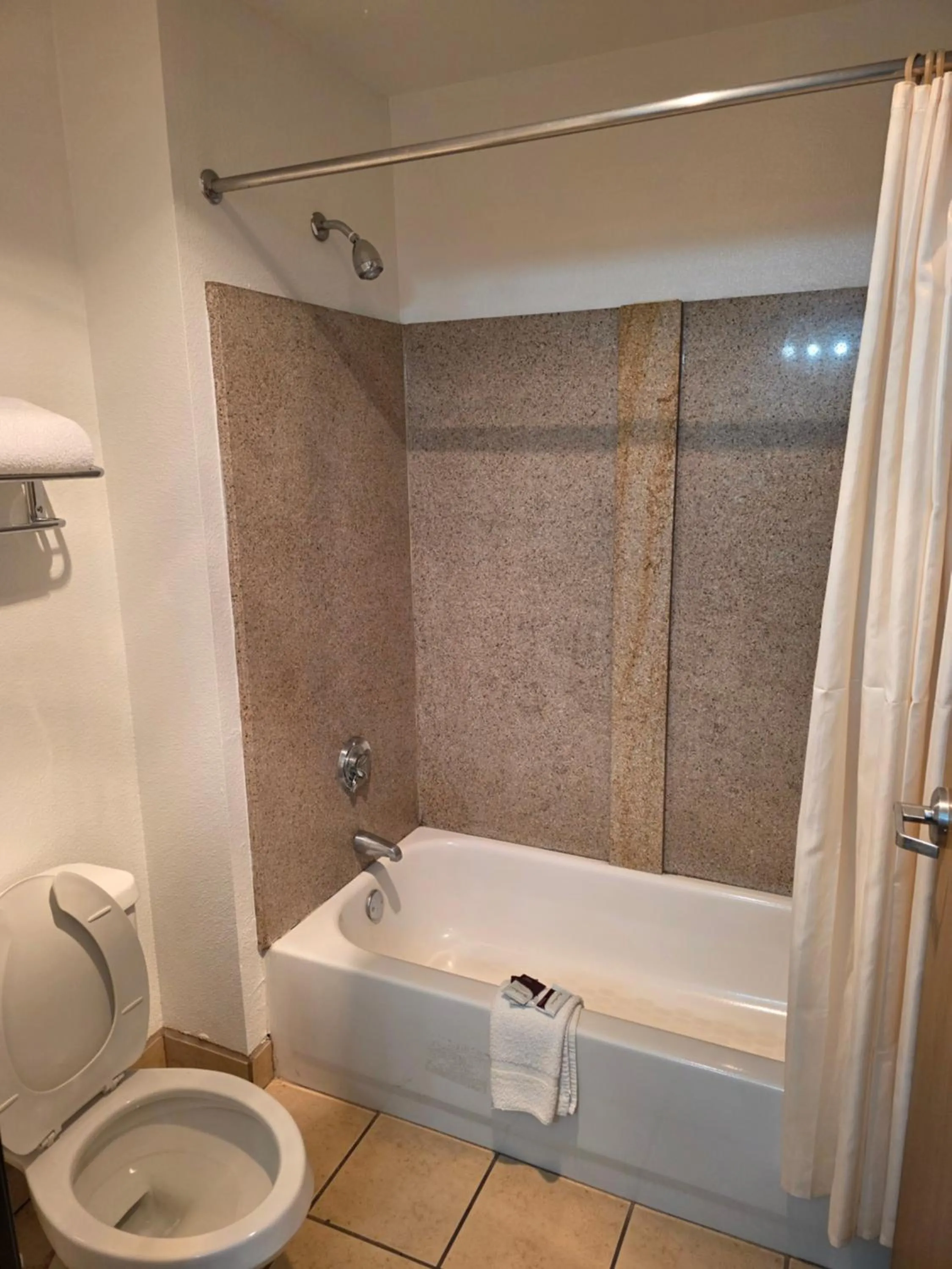 Shower in American Inn & Suites