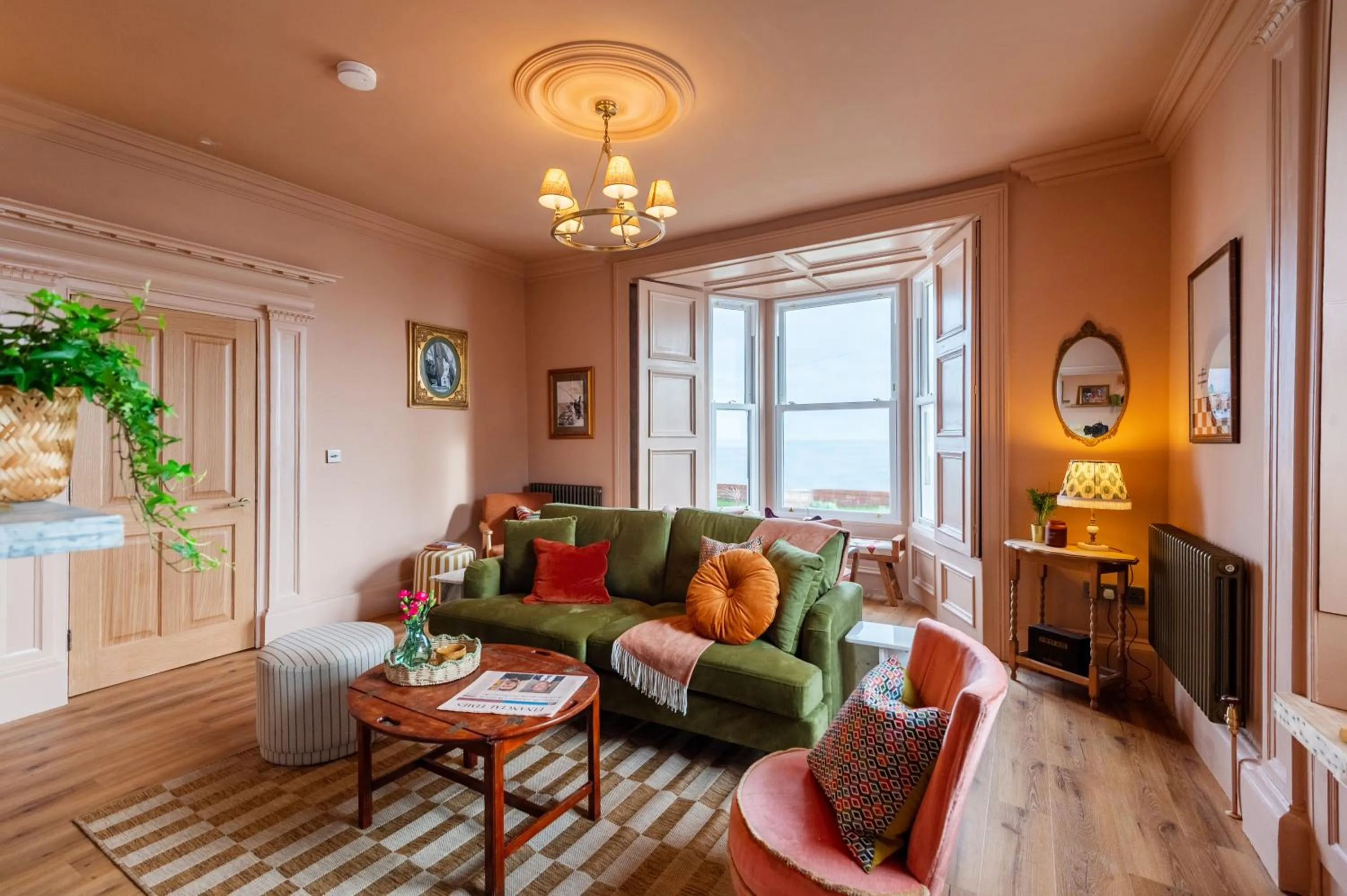 Communal lounge/ TV room in The Beach House Boutique Hotel