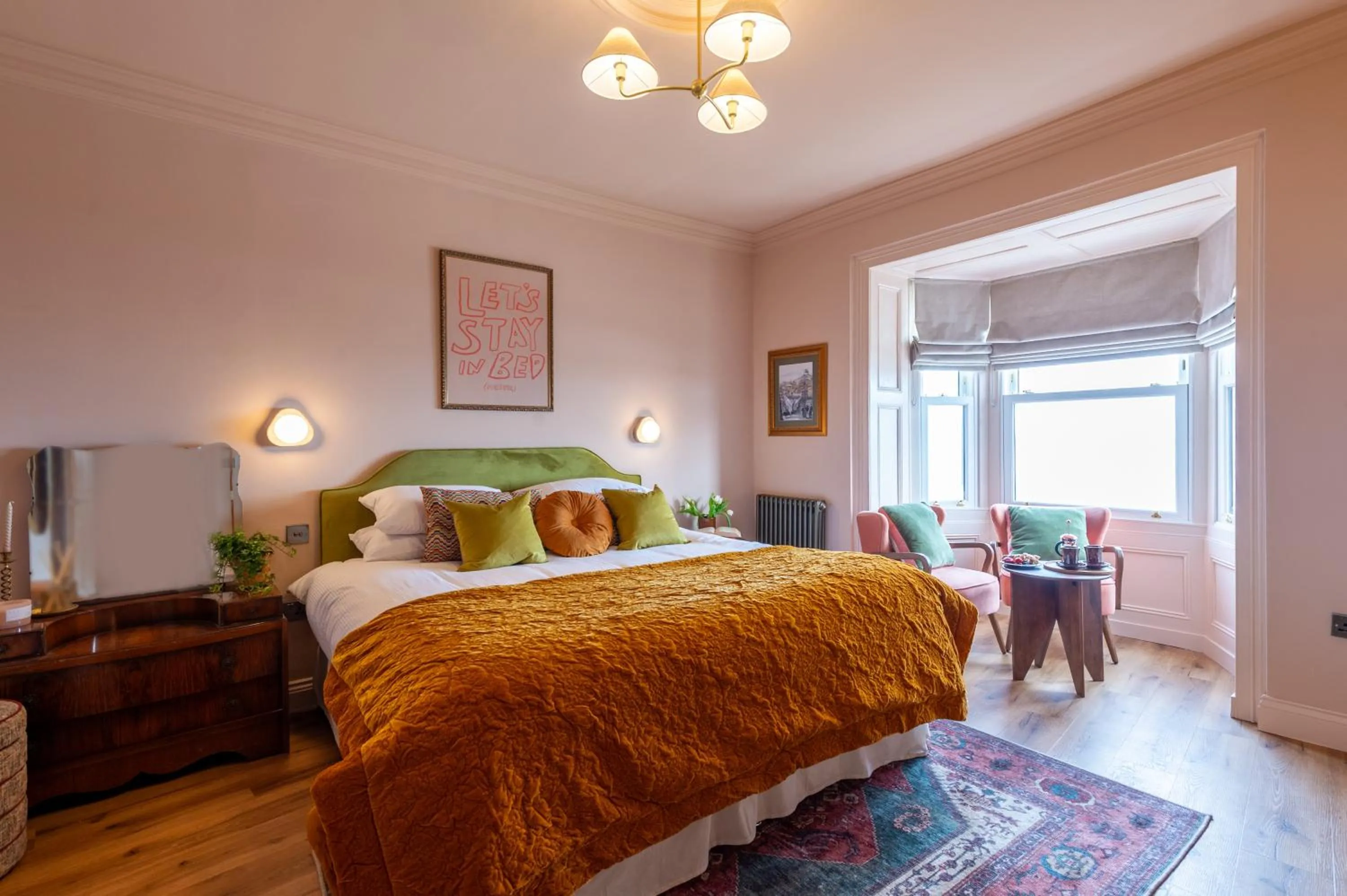 Communal lounge/ TV room, Bed in The Beach House Boutique Hotel